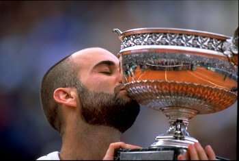6 Jun 1999:  Andre Agassi of the USA kisses the trophy after victory in the 1999 French Open Final match at Roland Garros in Paris, France.   \ Mandatory Credit: Al Bello /Allsport