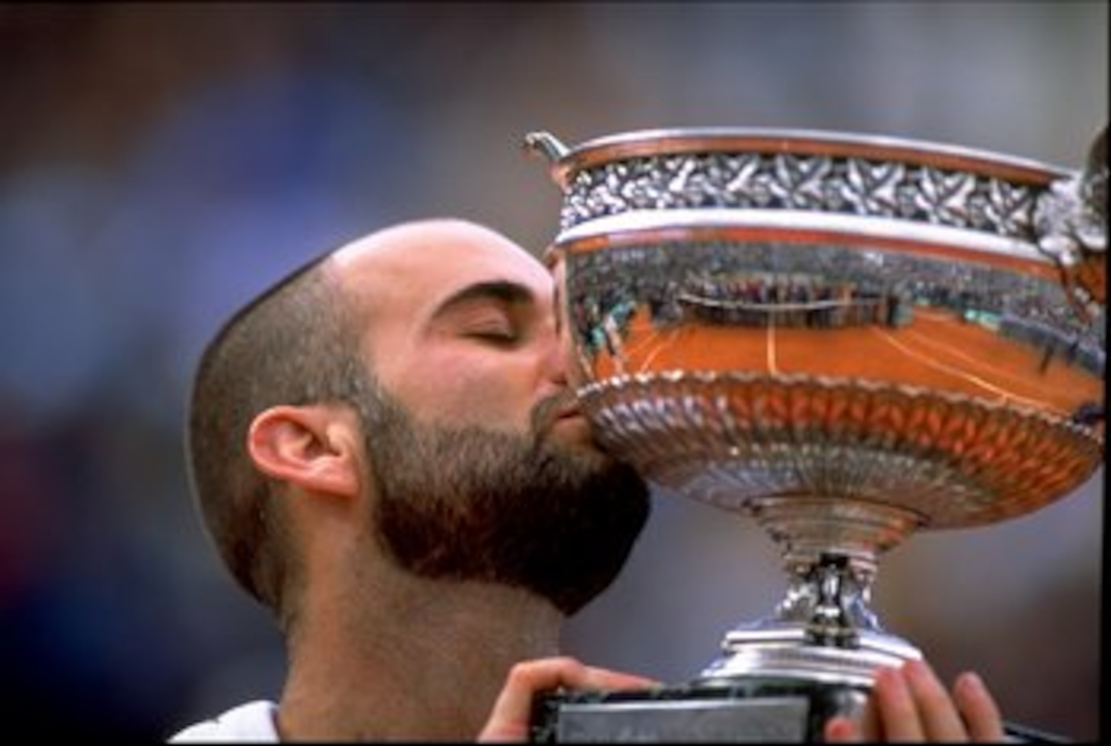 6 Jun 1999:  Andre Agassi of the USA kisses the trophy after victory in the 1999 French Open Final match at Roland Garros in Paris, France.   \ Mandatory Credit: Al Bello /Allsport