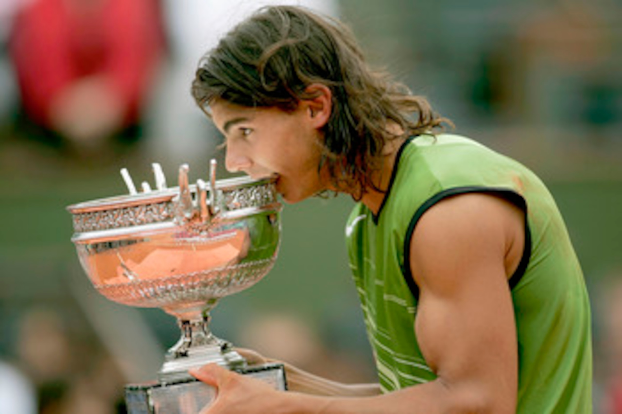 PARIS - JUNE 05:  Rafael Nadal of Spain poses with the winners trophy after his 3-1 sets victory over Mariano Puerta of Argentina during the Mens Final match during the fourteenth day of the French Open at Roland Garros on June 5, 2005 in Paris, France.  