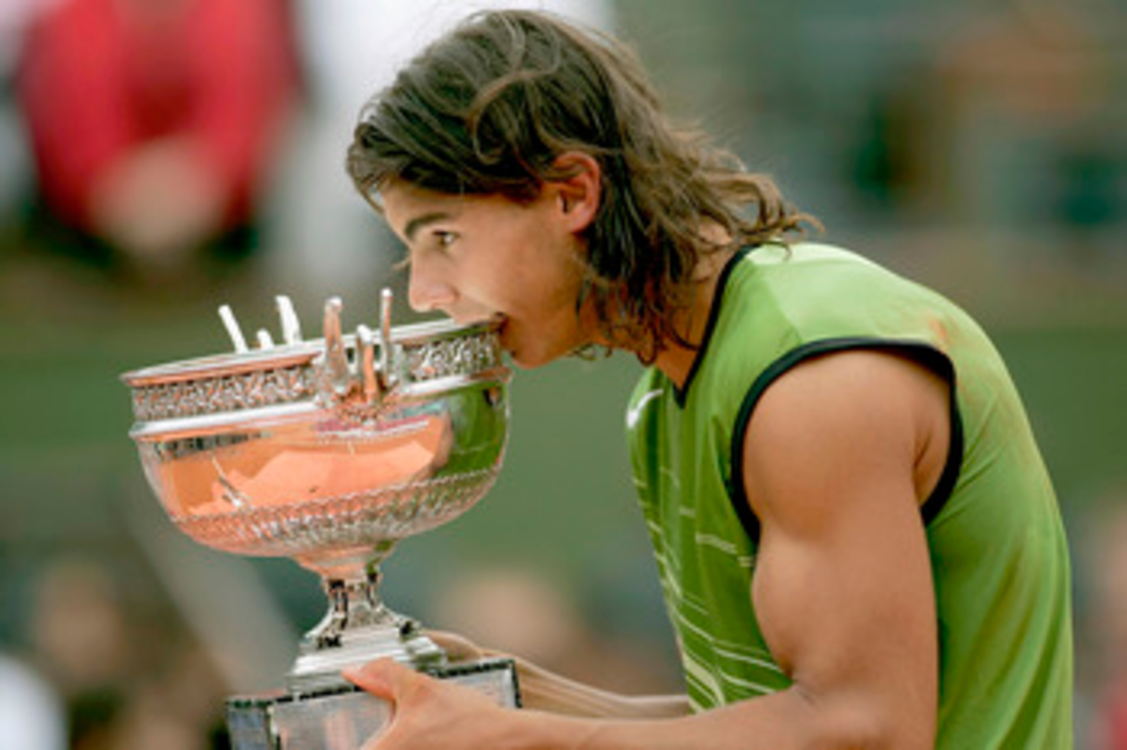 PARIS - JUNE 05:  Rafael Nadal of Spain poses with the winners trophy after his 3-1 sets victory over Mariano Puerta of Argentina during the Mens Final match during the fourteenth day of the French Open at Roland Garros on June 5, 2005 in Paris, France.  