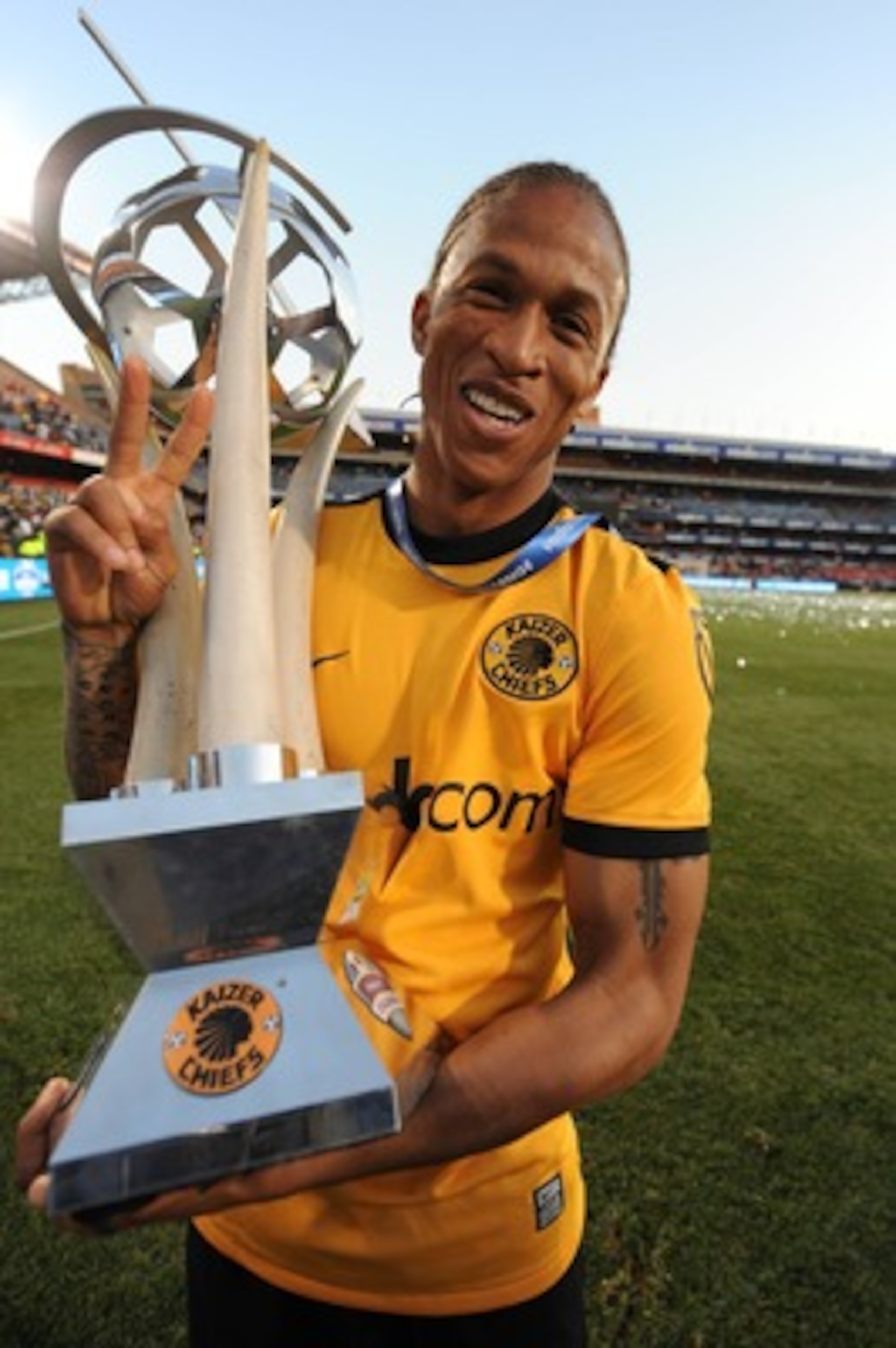 PRETORIA, SOUTH AFRICA - JULY 25, Josta Dladla of Kaiser Chiefs celebrates with the trophy during the final of the 2009 Vodacom Challenge match between Kaizer Chiefs and Manchester City at Loftus Versfeld Stadium on July 25, 2009 in Pretoria, South Africa