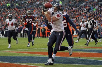 DENVER - DECEMBER 26:  Wide receiver Owen Daniels #91 of the Houston Texas makes a first quarter touchdown reception in front of D.J. Williams #55 of the Denver Broncos at INVESCO Field at Mile High on December 26, 2010 in Denver, Colorado. The Broncos de