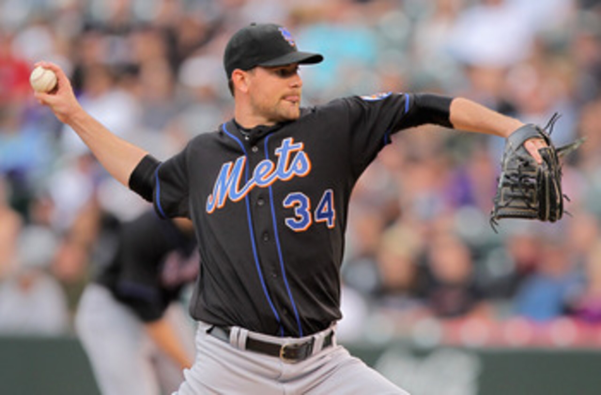 DENVER, CO - MAY 10:  Starting pitcher Mike Pelfrey #34 of the New York Mets delivers against the Colorado Rockies at Coors Field on May 10, 2011 in Denver, Colorado.  (Photo by Doug Pensinger/Getty Images)