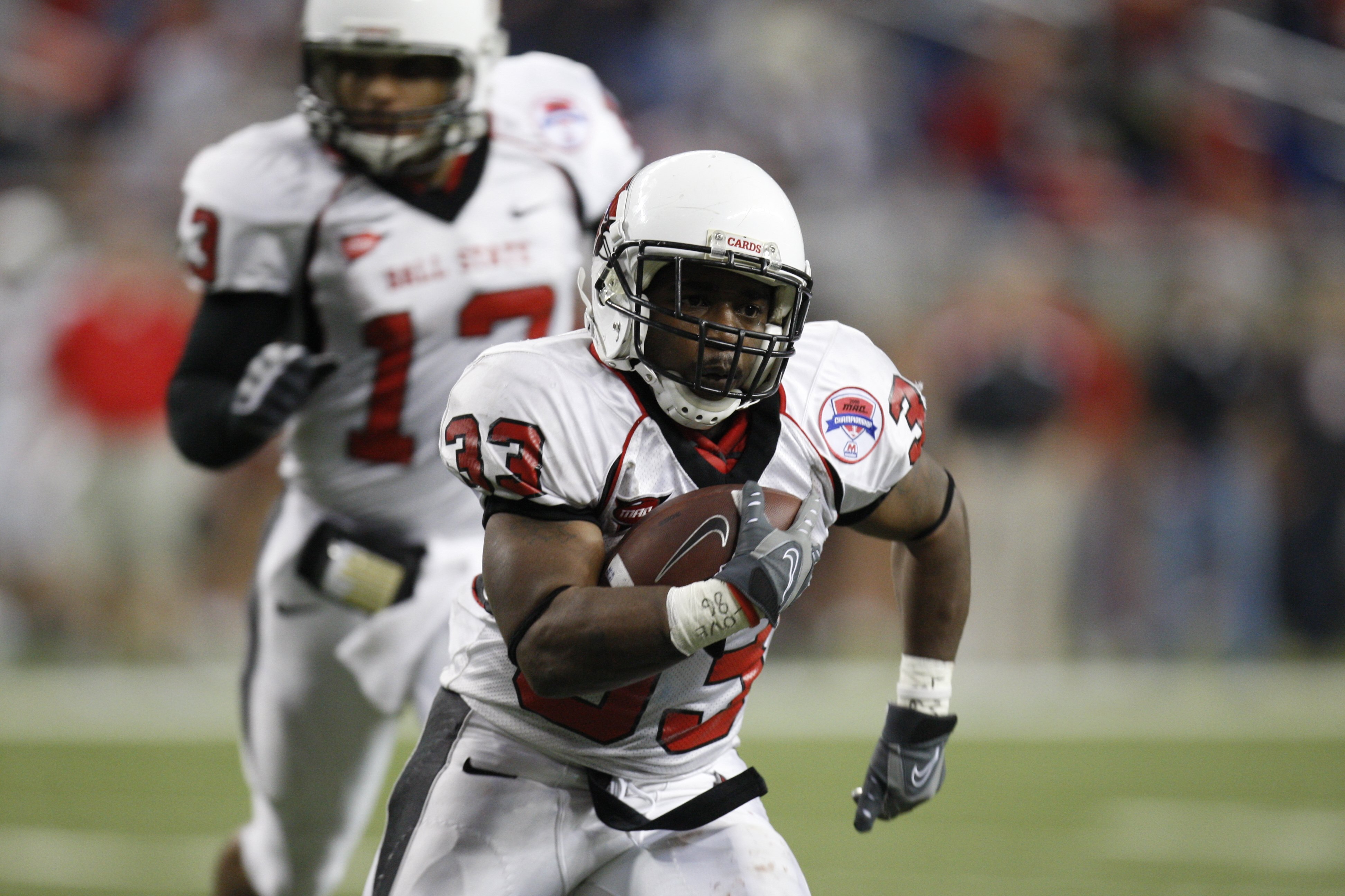 DETROIT - DECEMBER 5:  MiQuale Lewis #33 of the Ball State Cardinals runs the ball against the Buffalo Bulls during the MAC Championship game on December 5, 2008 at Ford Field in Detroit Michigan. (Photo by: Gregory Shamus/Getty Images)