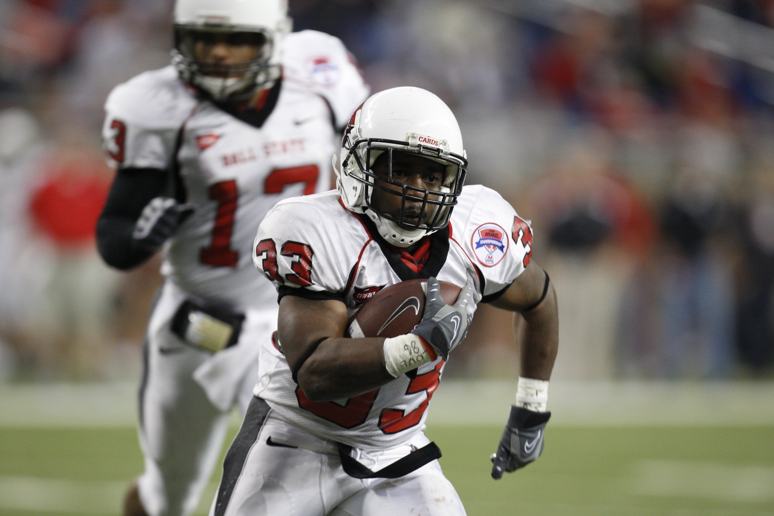 DETROIT - DECEMBER 5:  MiQuale Lewis #33 of the Ball State Cardinals runs the ball against the Buffalo Bulls during the MAC Championship game on December 5, 2008 at Ford Field in Detroit Michigan. (Photo by: Gregory Shamus/Getty Images)