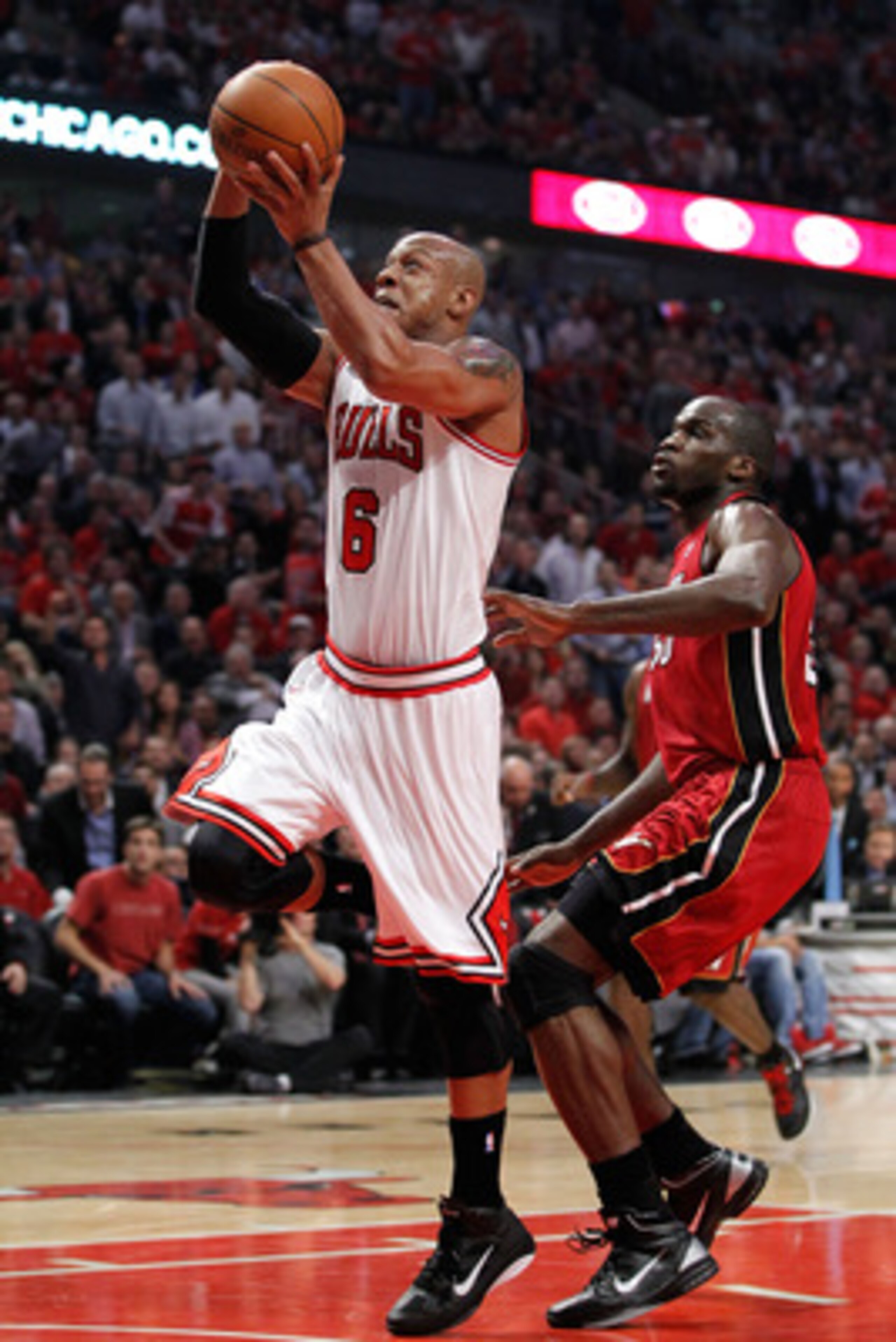 CHICAGO, IL - MAY 18:  Keith Bogans #6 of the Chicago Bulls drives for a shot attempt against the Miami Heat in Game Two of the Eastern Conference Finals during the 2011 NBA Playoffs on May 18, 2011 at the United Center in Chicago, Illinois. NOTE TO USER: