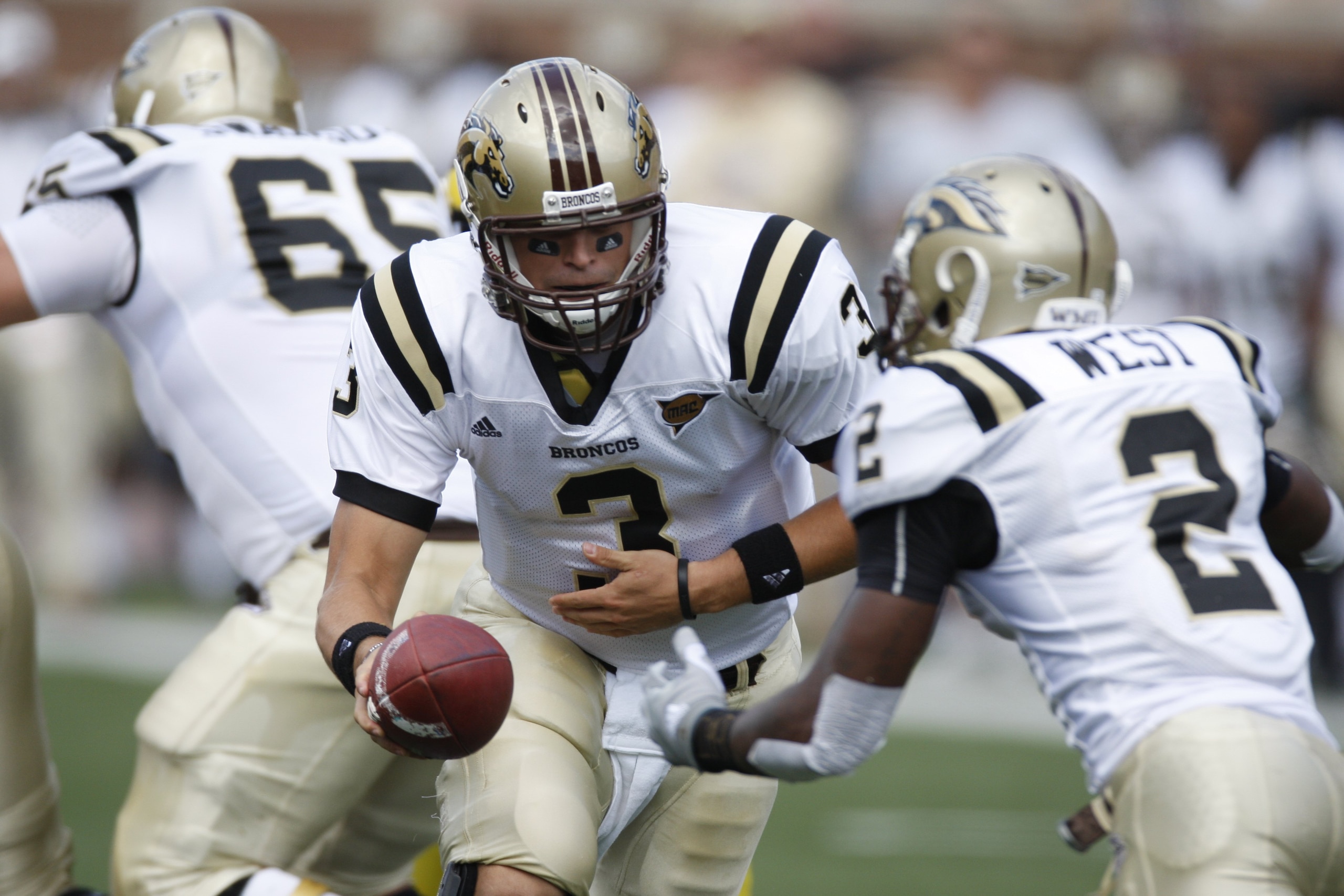 ANN ARBOR, MI - SEPTEMBER 5:  Tim Hiller #3 of the Western Michigan Broncos hands off to Brandon West #2 during the game against the Michigan Wolverines on September 5, 2009 at Michigan Stadium in Ann Arbor, Michigan. (Photo by Gregory Shamus/Getty Images