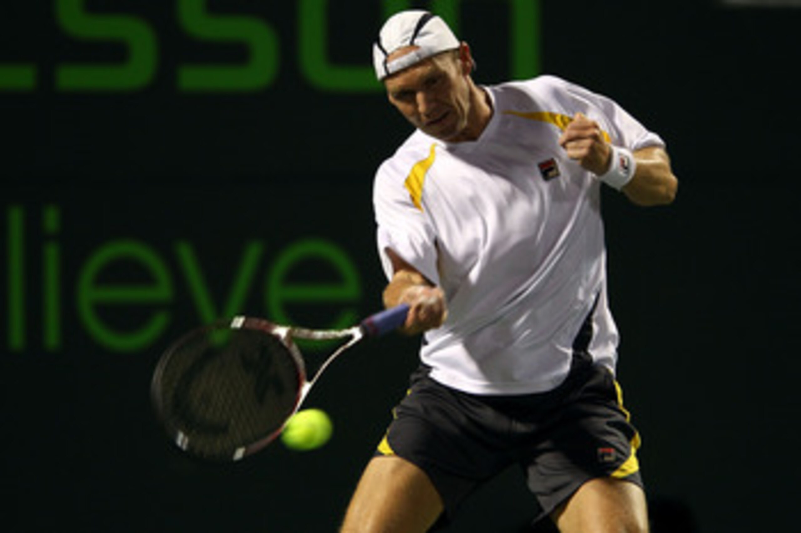 KEY BISCAYNE, FL - MARCH 24:  Rainer Schuettler of Germany hits a return against Ryan Harrison during the Sony Ericsson Open at Crandon Park Tennis Center on March 24, 2011 in Key Biscayne, Florida.  (Photo by Clive Brunskill/Getty Images)