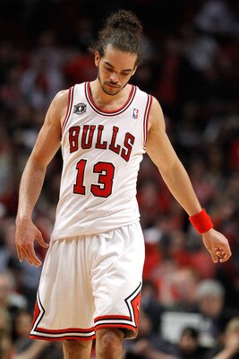 CHICAGO, IL - MAY 18:  Joakim Noah #13 of the Chicago Bulls walks up court with hi shead down against the Miami Heat in Game Two of the Eastern Conference Finals during the 2011 NBA Playoffs on May 18, 2011 at the United Center in Chicago, Illinois. The H