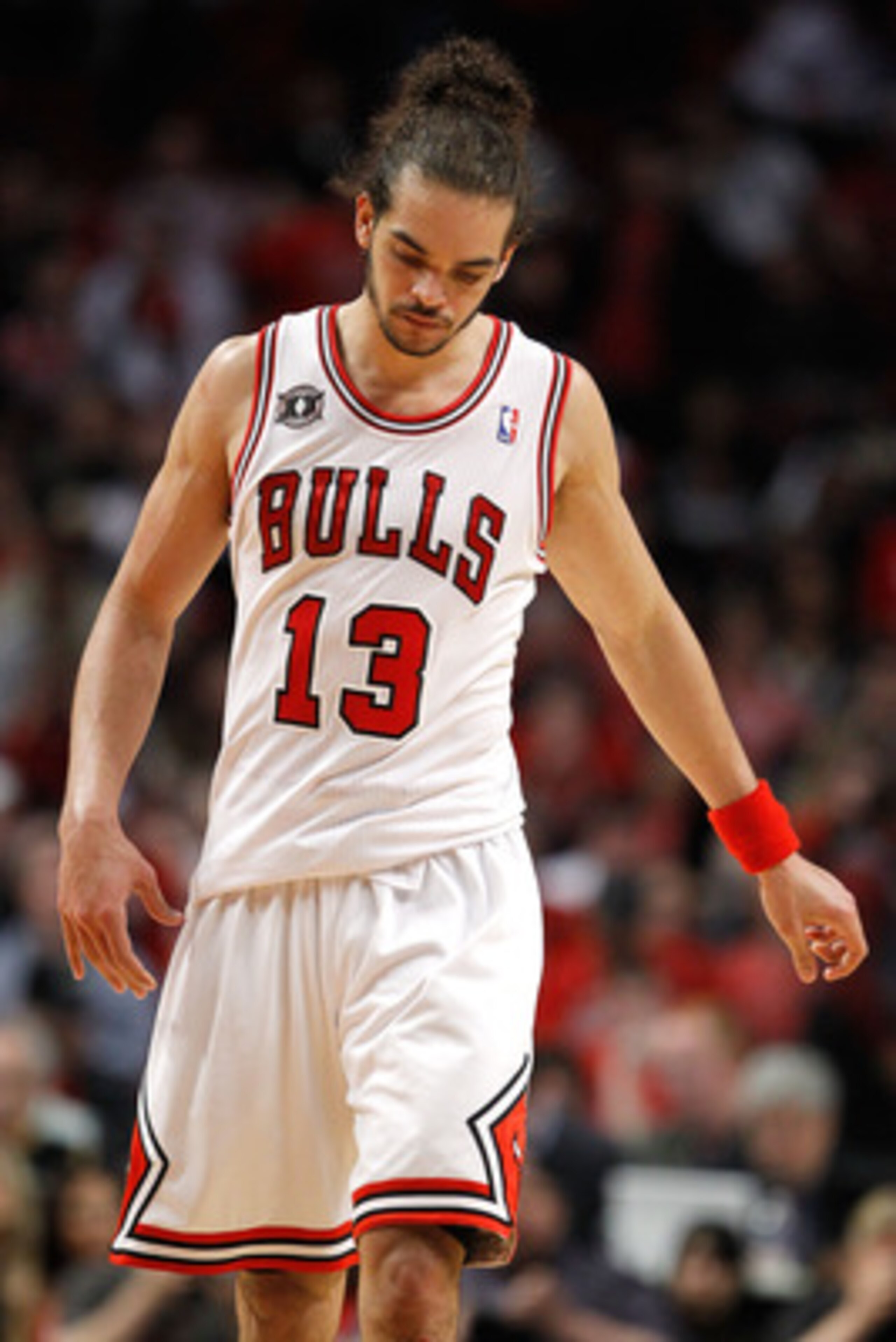 CHICAGO, IL - MAY 18:  Joakim Noah #13 of the Chicago Bulls walks up court with hi shead down against the Miami Heat in Game Two of the Eastern Conference Finals during the 2011 NBA Playoffs on May 18, 2011 at the United Center in Chicago, Illinois. The H