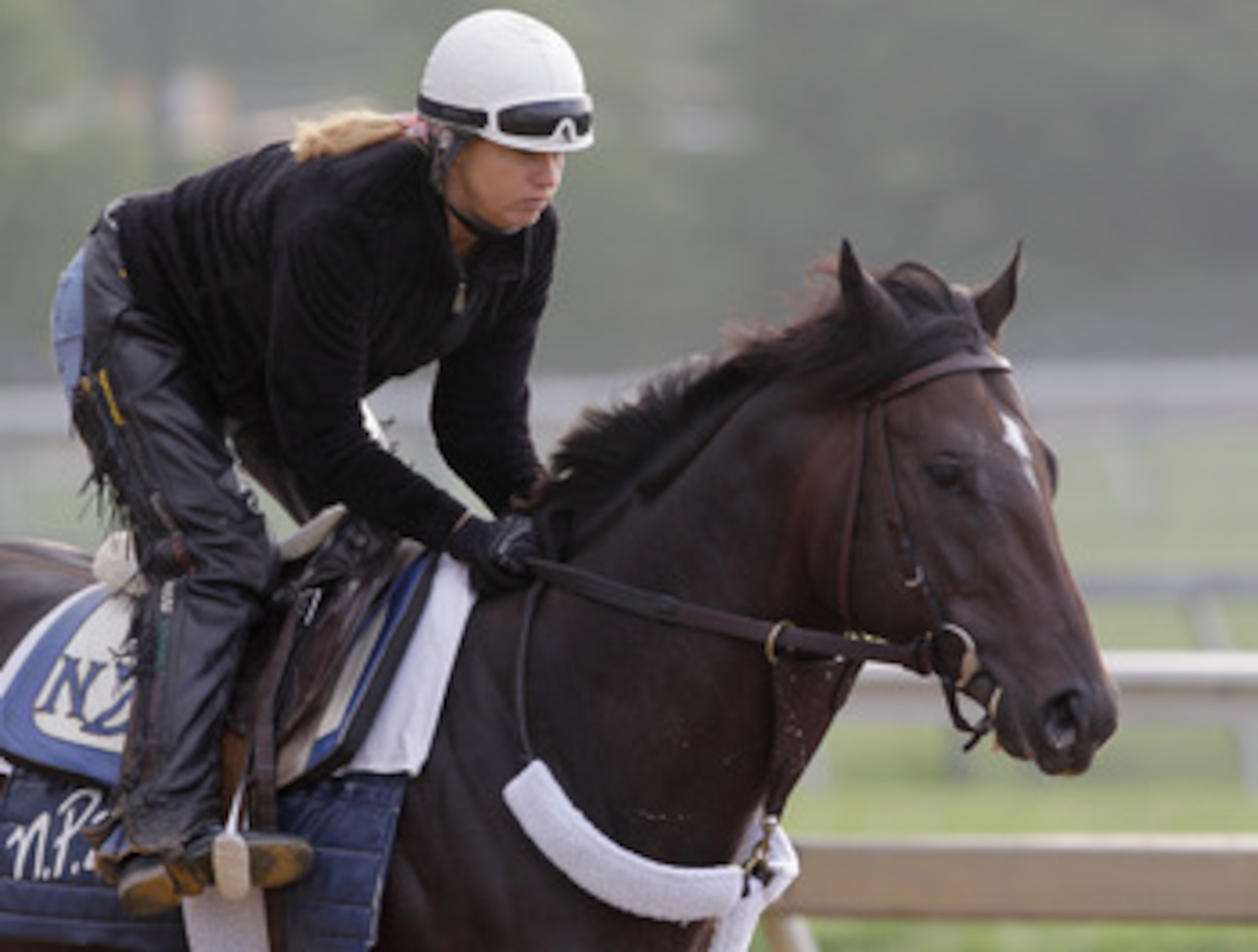 BALTIMORE, MD - MAY 20:  Exercise rider Stacy Prior takes Preakness entrant Dialed In over the track at Pimlico Race Course on May 20, 2011 in Baltimore, Maryland. The 136th running of the Preakness Stakes will take place on May 21.   (Photo by Rob Carr/G