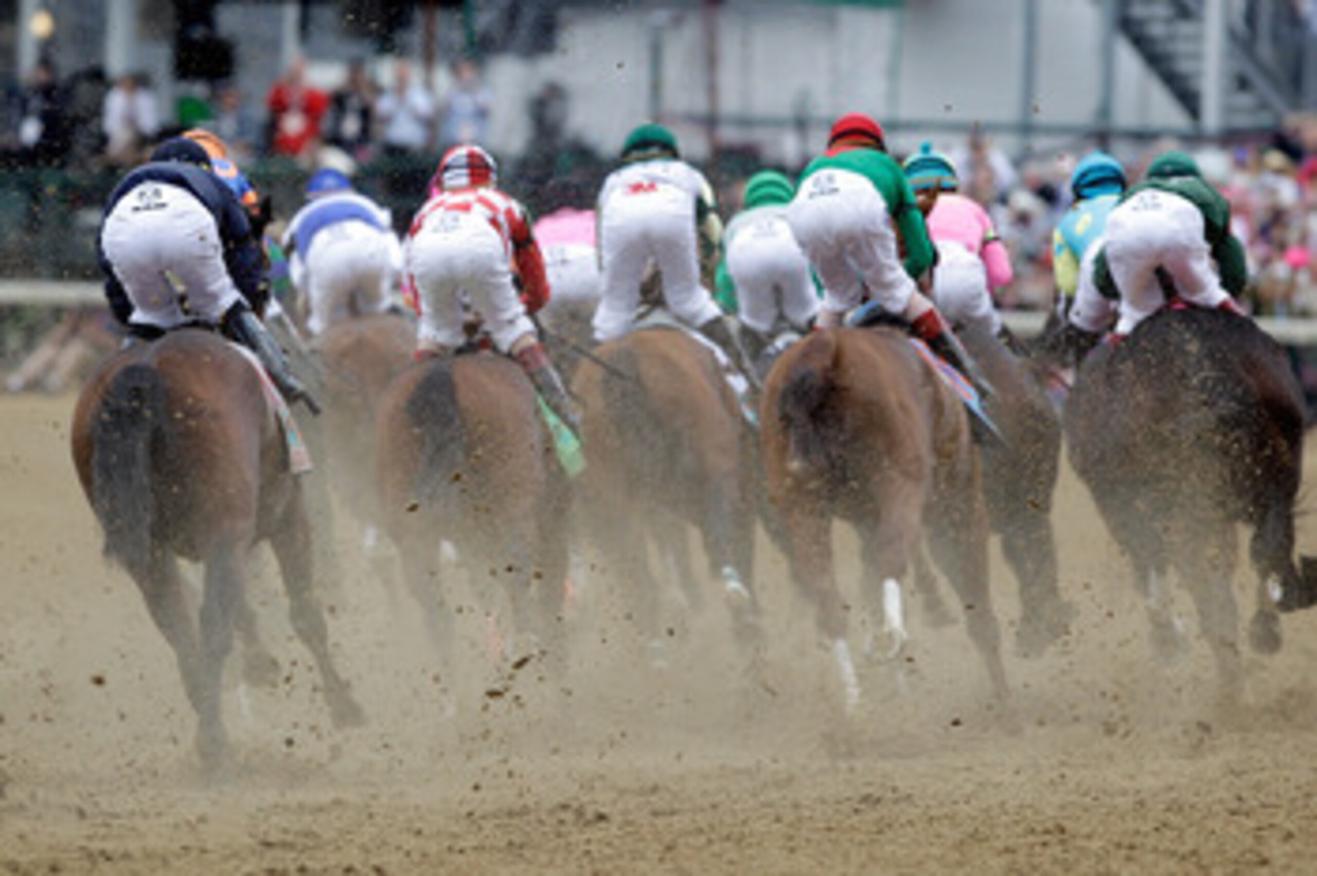 LOUISVILLE, KY - MAY 07:  Jockeys and horses race around turn one during the 137th Kentucky Derby at Churchill Downs on May 7, 2011 in Louisville, Kentucky.  (Photo by Rob Carr/Getty Images)