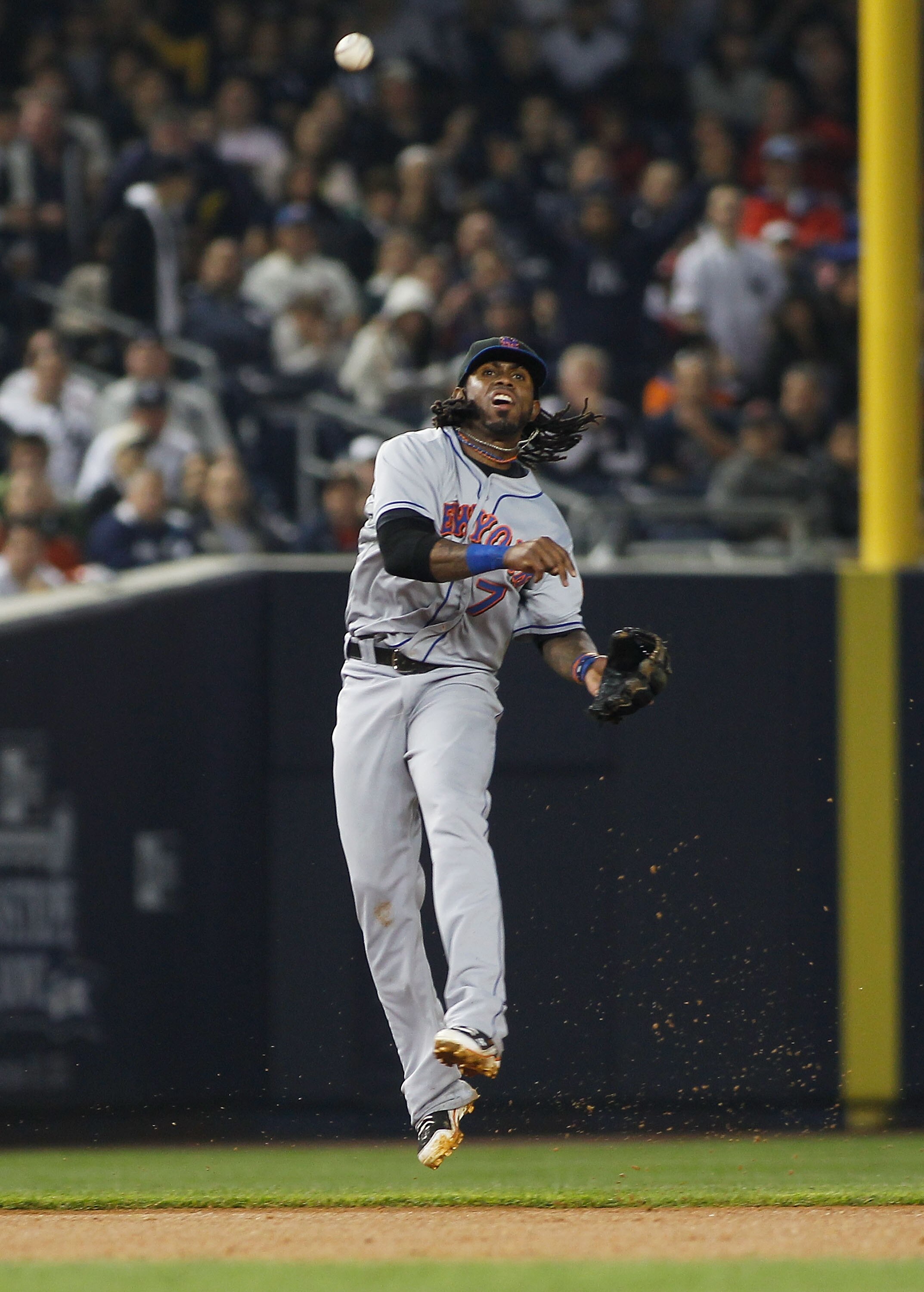 NEW YORK - MAY 20:  Jose Reyes #7 of the New York Mets atempts to throw out the runner on a ground ball during the game against New York Yankees on May 20, 2011 at Yankee Stadium in the Bronx borough of New York City.  (Photo by Mike Stobe/Getty Images)