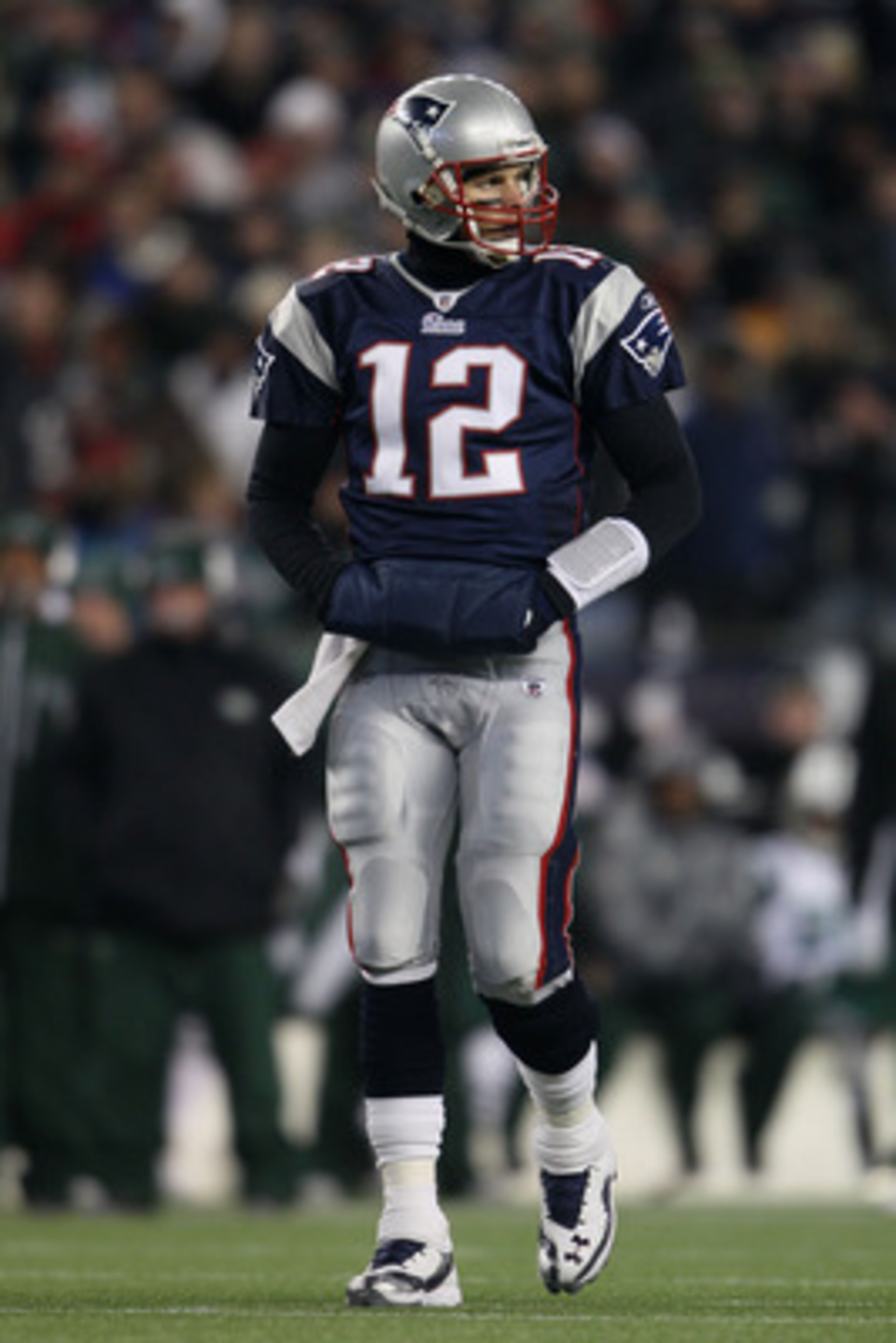 FOXBORO, MA - JANUARY 16: Quarterback Tom Brady #12 of the New England Patriots stands on the field during their 2011 AFC divisional playoff game against the New York Jets at Gillette Stadium on January 16, 2011 in Foxboro, Massachusetts. (Photo by Elsa FOXBORO, MA - JANUARY 16: Quarterback Tom Brady #12 of the New England Patriots stands on the field during their 2011 AFC divisional playoff game against the New York Jets at Gillette Stadium on January 16, 2011 in Foxboro, Massachusetts. (Photo by Elsa