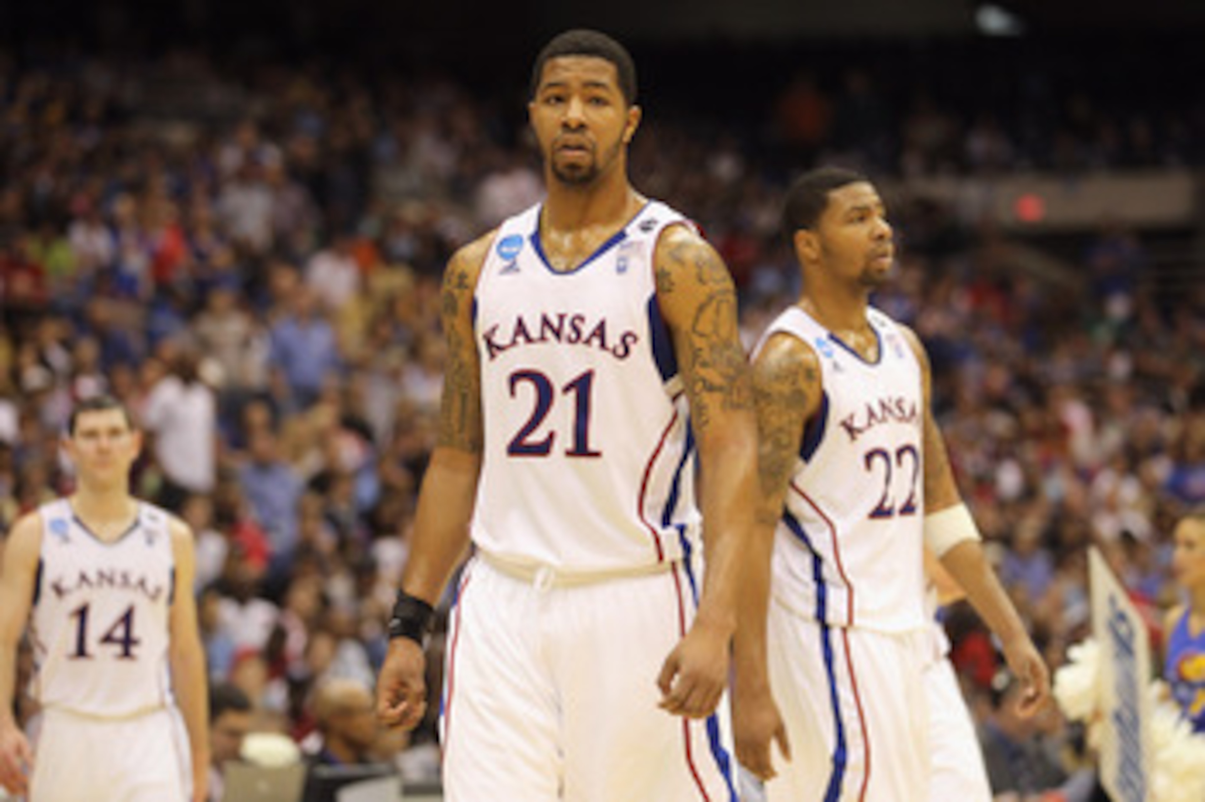 SAN ANTONIO, TX - MARCH 27: Markieff Morris #21 and Marcus Morris #22 of the Kansas Jayhawks react during the southwest regional final of the 2011 NCAA men's basketball tournament against the Virginia Commonwealth Rams at the Alamodome on March 27, 2011 SAN ANTONIO, TX - MARCH 27: Markieff Morris #21 and Marcus Morris #22 of the Kansas Jayhawks react during the southwest regional final of the 2011 NCAA men's basketball tournament against the Virginia Commonwealth Rams at the Alamodome on March 27, 2011