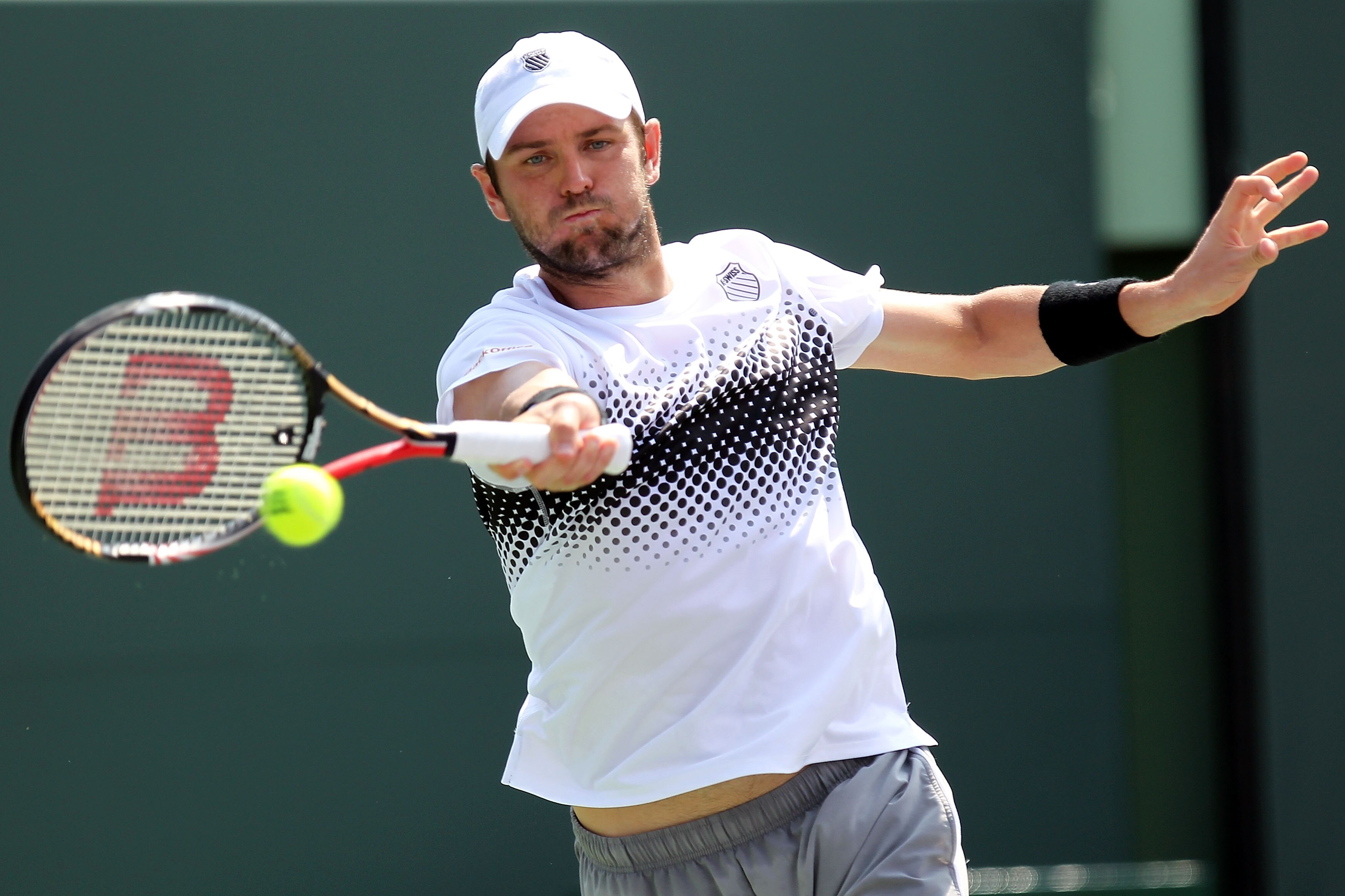 KEY BISCAYNE, FL - APRIL 01:  Mardy Fish hits a forehand return against Novak Djokovic of Serbia during their semifinal match at the Sony Ericsson Open at Crandon Park Tennis Center on April 1, 2011 in Key Biscayne, Florida.  (Photo by Al Bello/Getty Imag