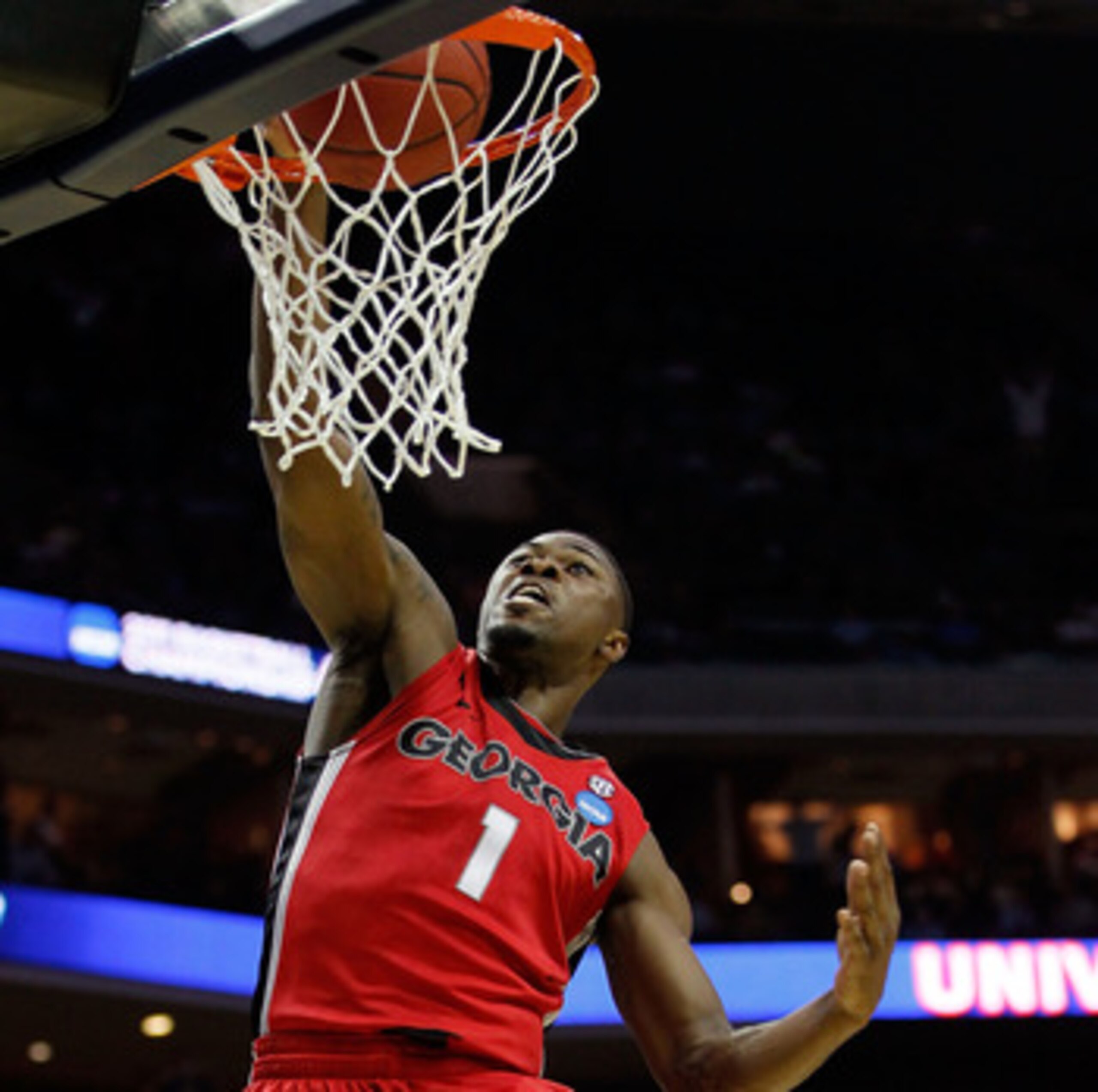 CHARLOTTE, NC - MARCH 18:  Travis Leslie #1 of the Georgia Bulldogs dunks the ball in the first half while taking on the Washington Huskies during the second round of the 2011 NCAA men's basketball tournament at Time Warner Cable Arena on March 18, 2011 i