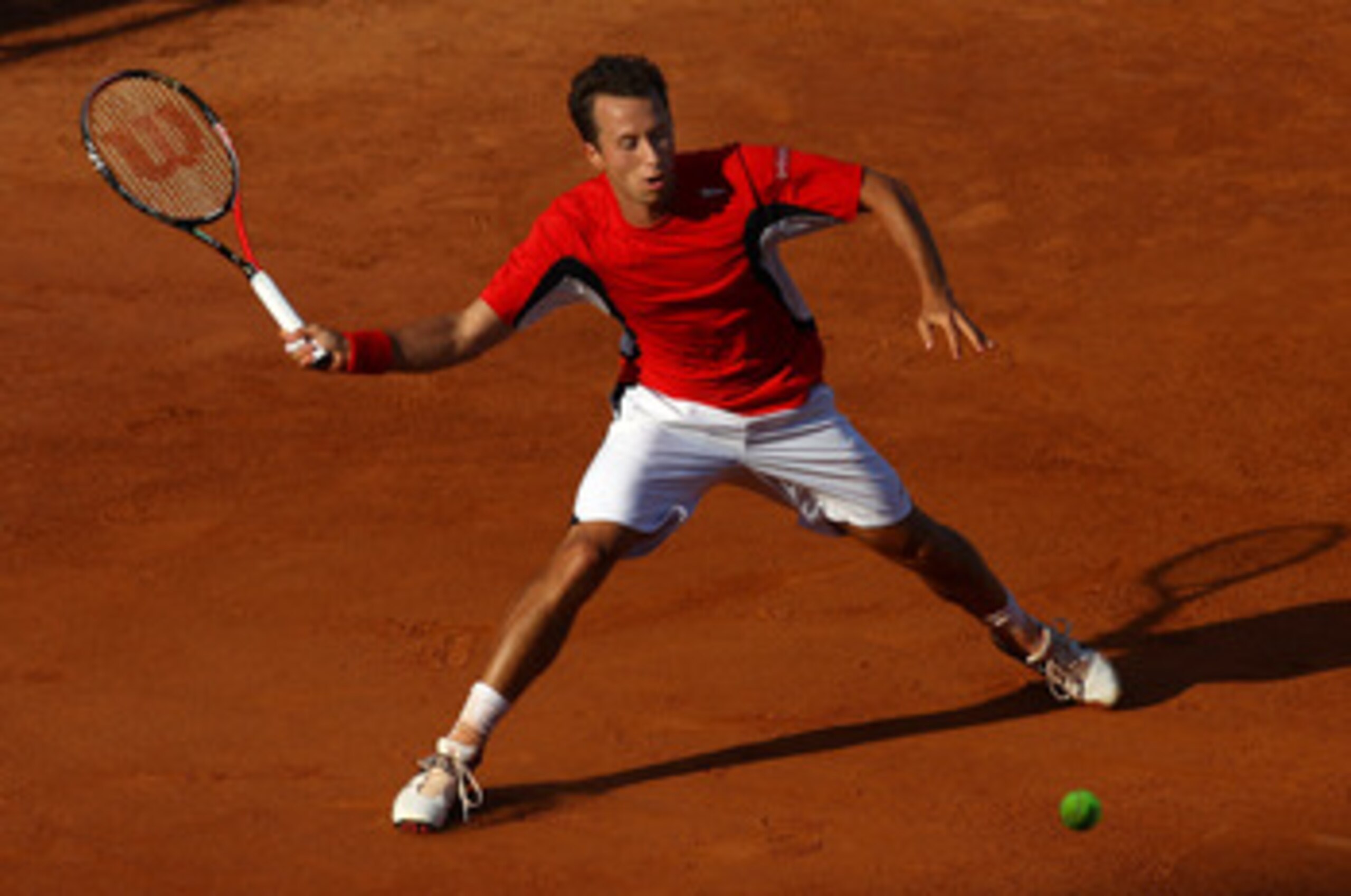 ROME, ITALY - MAY 11:  Phillip Kohlschreiber of Germany plays a forehand return during his second round defeat to Feliciano Lopez of Spain during day four of the Internazionali BNL d'Italia at the Foro Italico Tennis Centreon May 11, 2011 in Rome, Italy. 