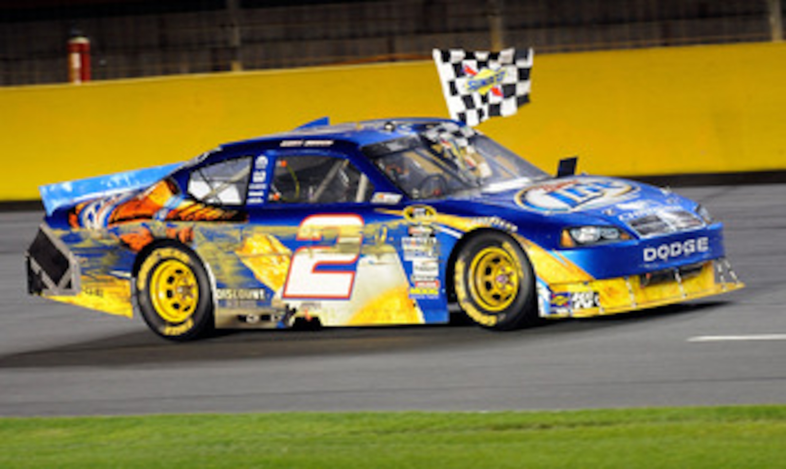CONCORD, NC - MAY 22:  Kurt Busch, driver of the #2 Miller Lite Dodge, celebrates by driving backwards after winning the NASCAR Sprint All-Star Race at Charlotte Motor Speedway on May 22, 2010 in Concord, North Carolina.  (Photo by John Harrelson/Getty Im