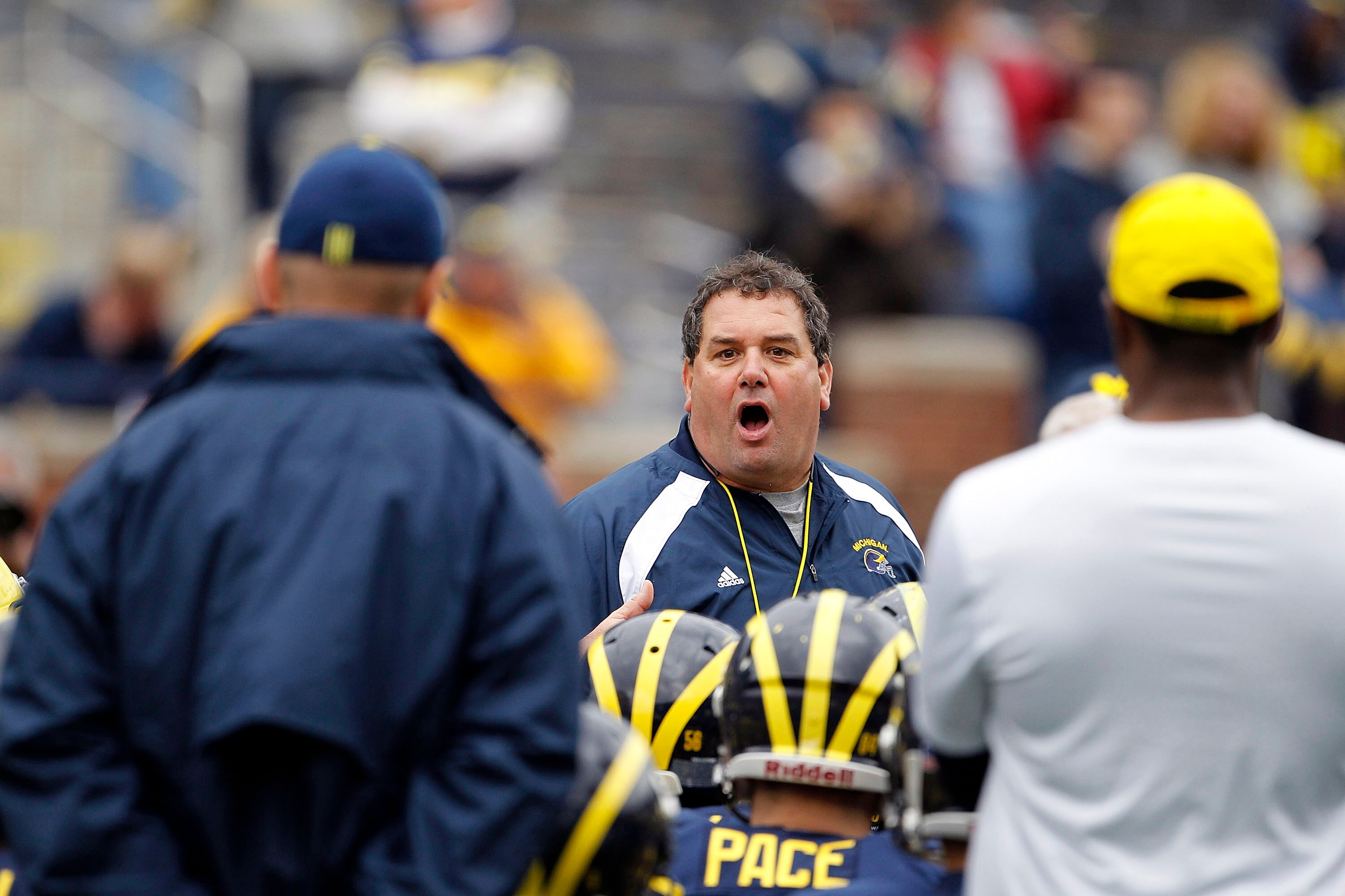 ANN ARBOR, MI - APRIL 16:  Head football coach Brady Hoke talks with his team during the annual Spring Game at Michigan Stadium on April 16, 2011 in Ann Arbor, Michigan.  (Photo by Leon Halip/Getty Images)