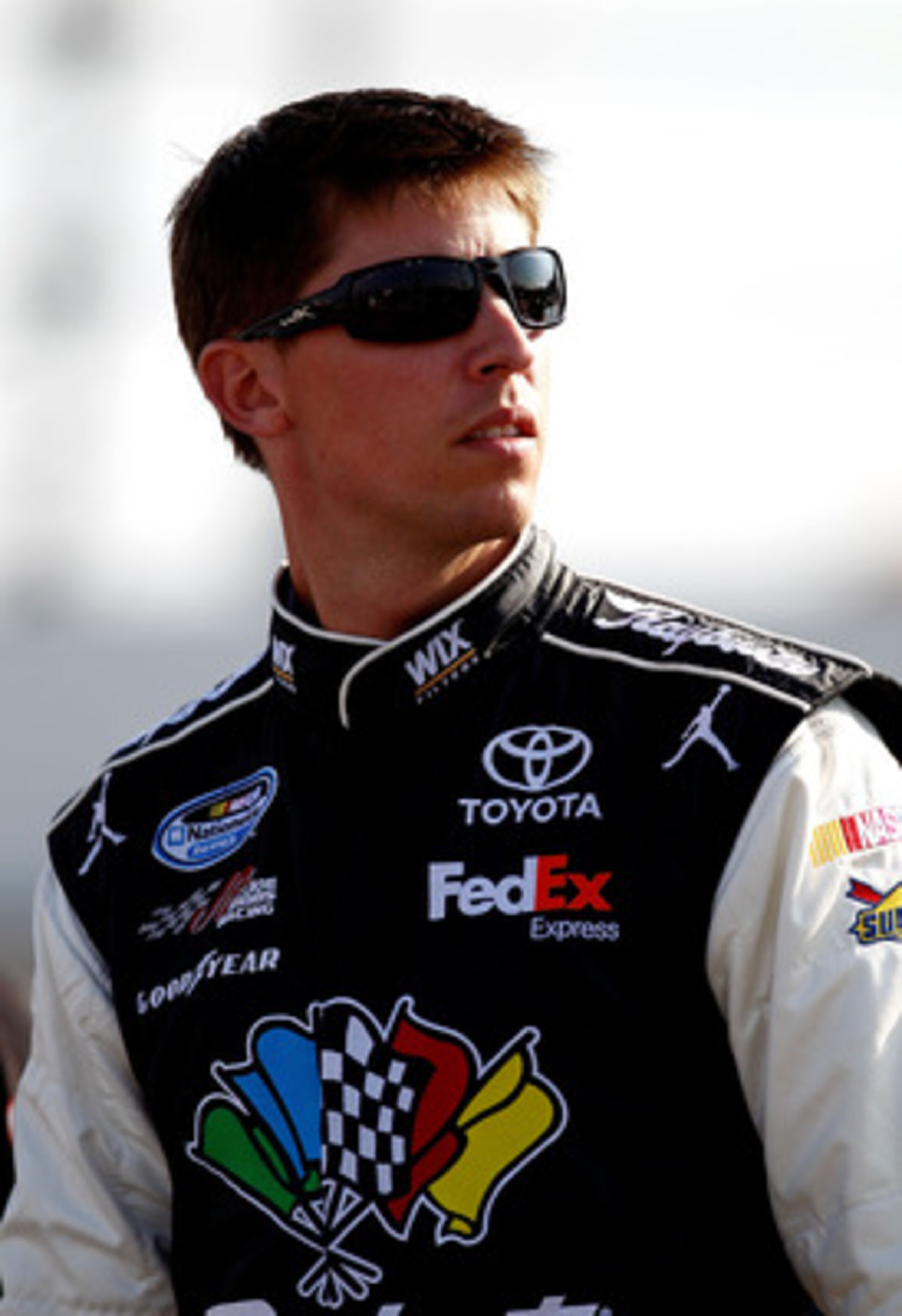 DARLINGTON, SC - MAY 06:  Denny Hamlin, driver of the #11 Sport Clips Toyota, stands on the grid during qualifying for the NASCAR Sprint Cup Series SHOWTIME Southern 500 at Darlington Raceway on May 6, 2011 in Darlington, South Carolina.  (Photo by Jeff Z