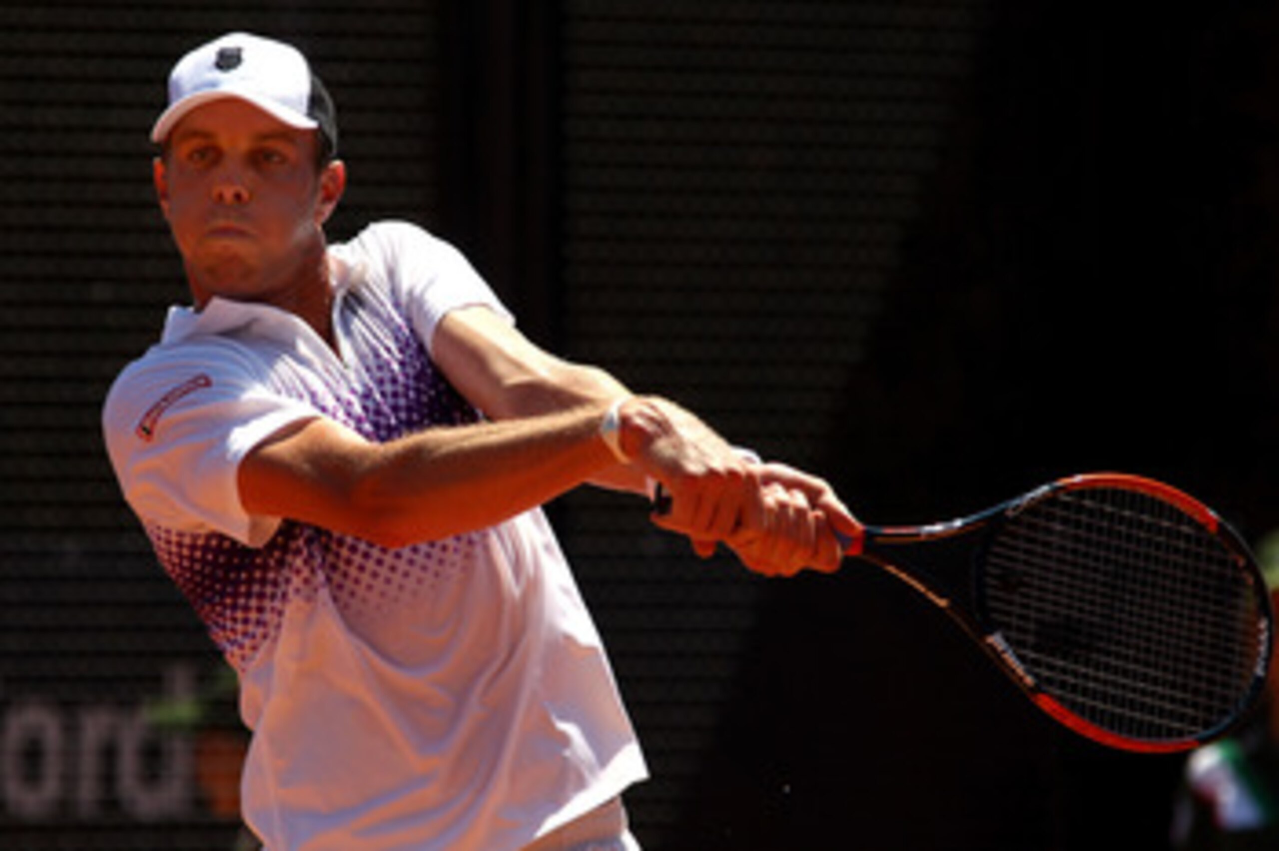 ROME, ITALY - MAY 10:  Sam Querrey of USA plays a backhand return during his first round match against Kevin Anderson of South Africa during day three of the Internazionali BNL d'Italia at the Foro Italico Tennis Centre on May 10, 2011 in Rome, Italy.  (P