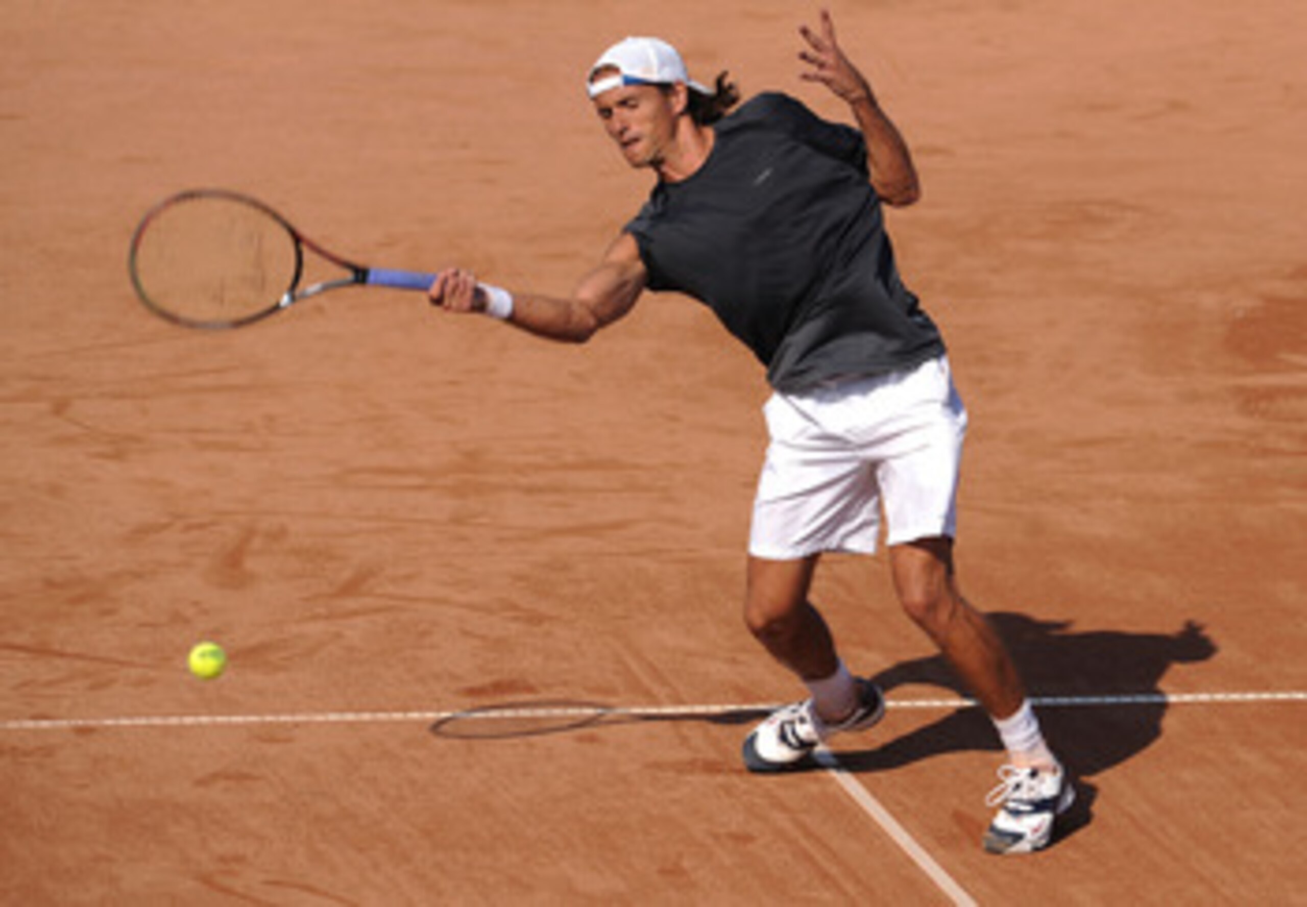 BUCHAREST, ROMANIA - SEPTEMBER 23:  Ruban Ramirez Hidalgo of Spain in action against Marius Copil of Romania during Round Two of the BCR Open Romania at the BNR Arena on September 23, 2009 in Bucharest, Romania.  (Photo by Christopher Lee/Getty Images)