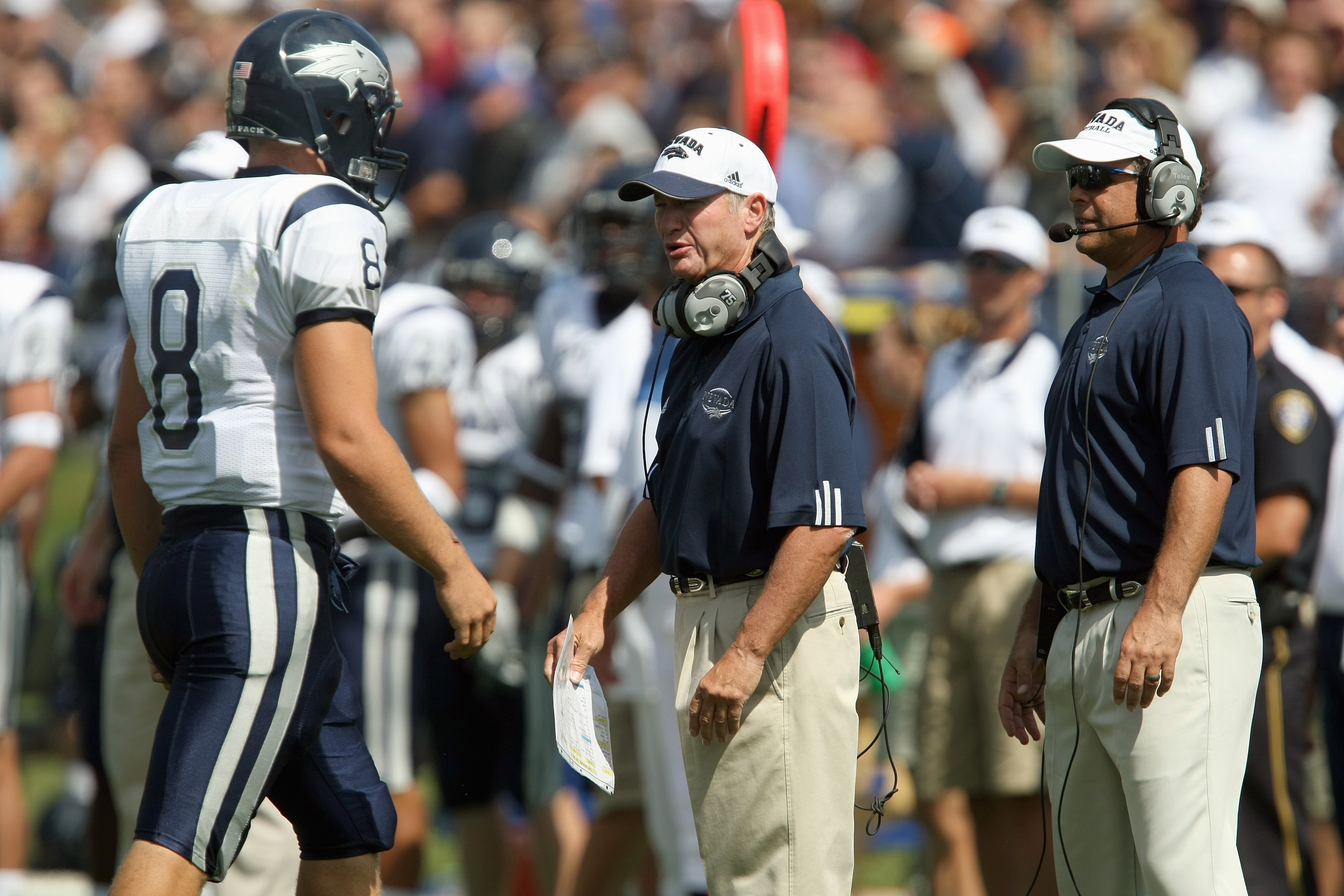 EVANSTON, IL - SEPTEMBER 8:  Head coach Chris Ault of the Nevada Wolf Pack talks with Nick Graziano # 8 against the Northwestern Wildcats on September 8, 2007 at Ryan Field at Northwestern University in Evanston, Illinois. (Photo by Jonathan Daniel/Getty