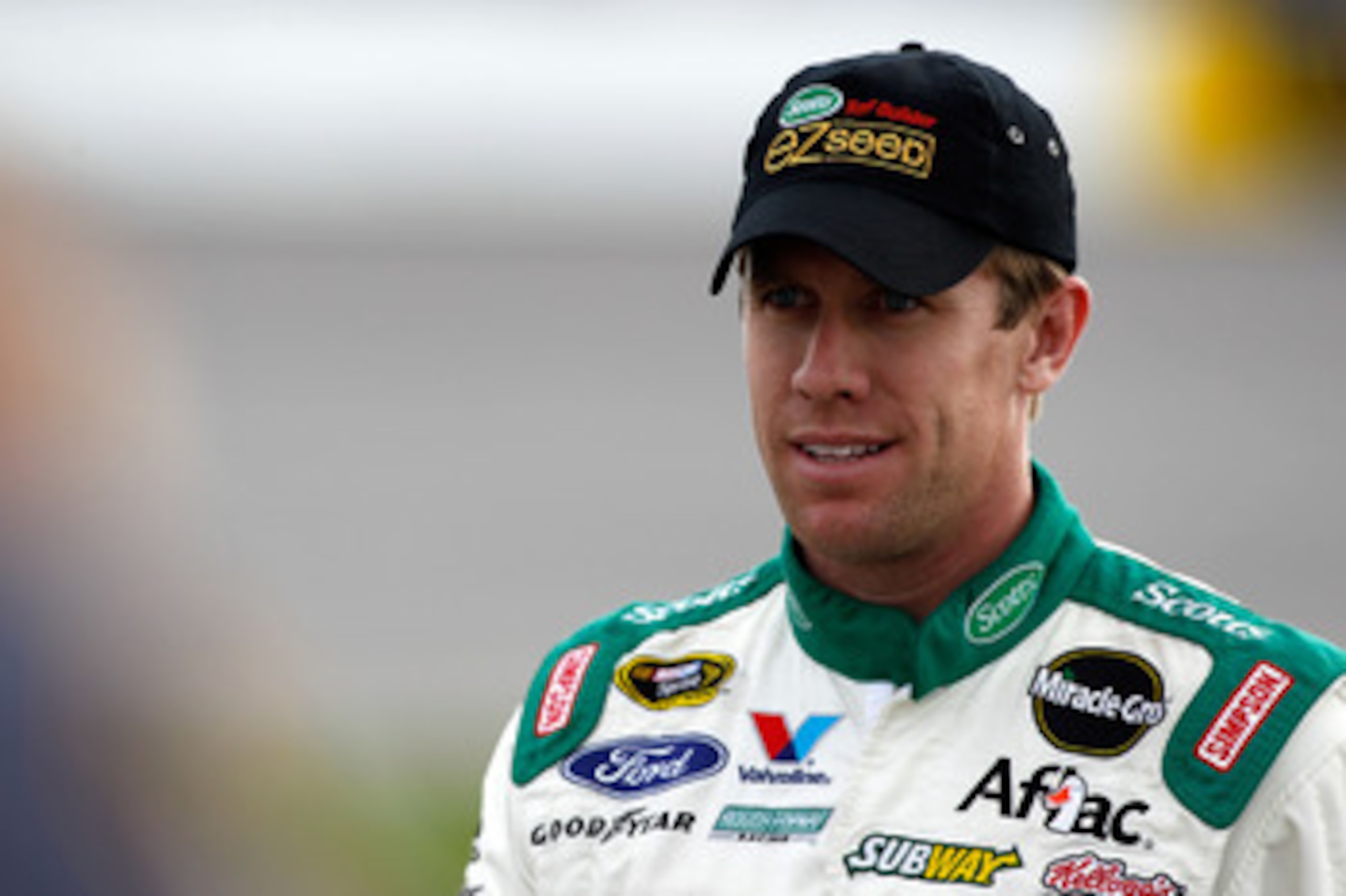 RICHMOND, VA - APRIL 29:  Carl Edwards, driver of the #99 Scotts EZ Seed Ford, stands on pit road during qualifying for the NASCAR Sprint Cup Series Crown Royal Presents The Matthew & Daniel Hansen 400 at Richmond International Raceway on April 29, 2011 i
