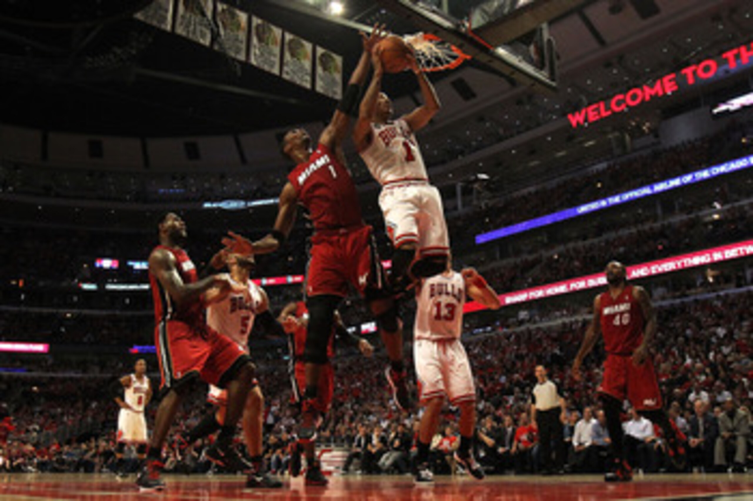 CHICAGO, IL - MAY 18: Derrick Rose #1 of the Chicago Bulls drives for a shot attempt against Chris Bosh #1 of the Miami Heat in Game Two of the Eastern Conference Finals during the 2011 NBA Playoffs on May 18, 2011 at the United Center in Chicago, Illinoi