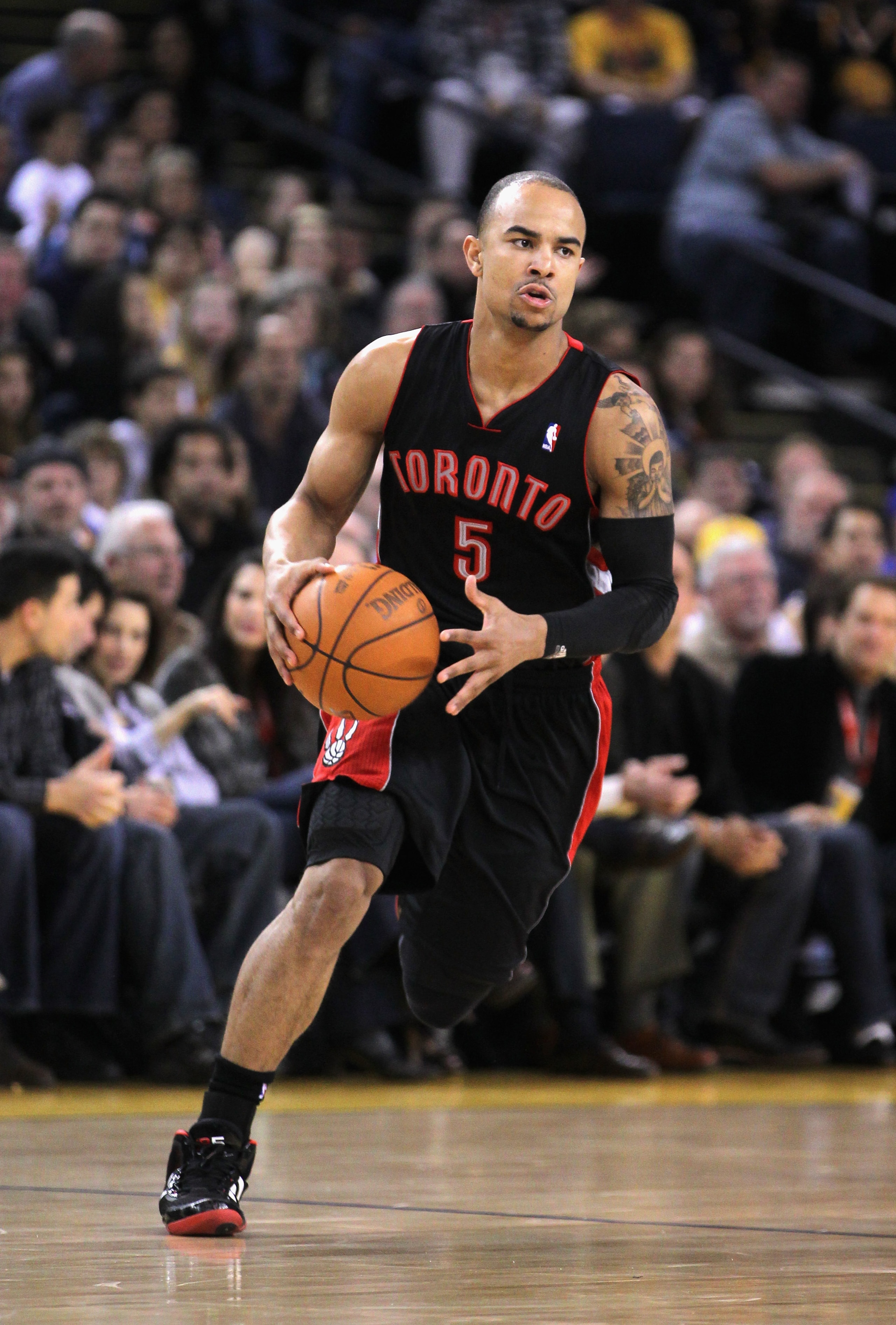 OAKLAND, CA - MARCH 25:  Jerryd Bayless #5 of the Toronto Raptors in action against the Golden State Warriors at Oracle Arena on March 25, 2011 in Oakland, California. NOTE TO USER: User expressly acknowledges and agrees that, by downloading and or using
