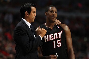 CHICAGO, IL - MAY 15:  Head coach Erik Spoelstra of the Miami Heat talks with Mario Chalmers #15 against the Chicago Bulls in Game One of the Eastern Conference Finals during the 2011 NBA Playoffs on May 15, 2011 at the United Center in Chicago, Illinois.