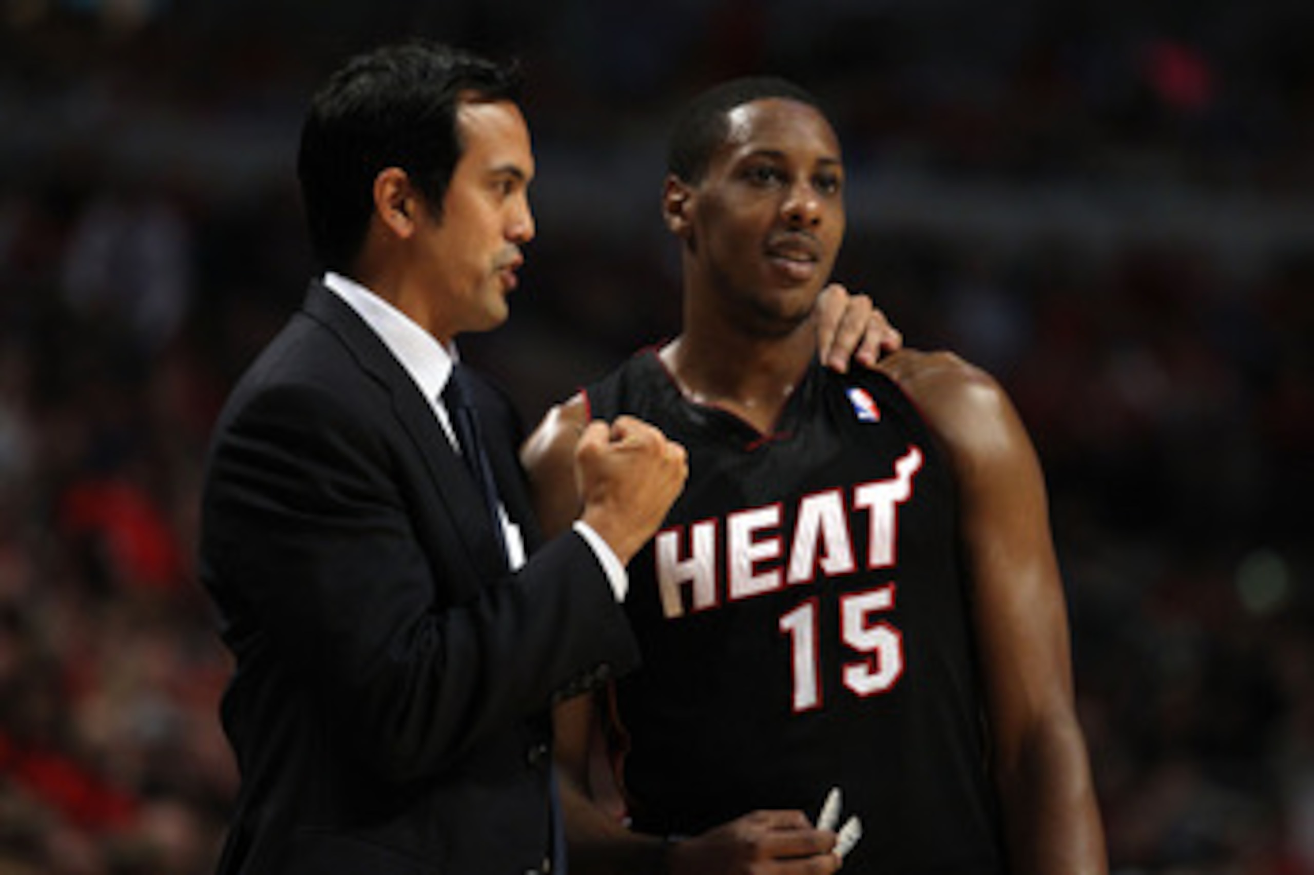 CHICAGO, IL - MAY 15:  Head coach Erik Spoelstra of the Miami Heat talks with Mario Chalmers #15 against the Chicago Bulls in Game One of the Eastern Conference Finals during the 2011 NBA Playoffs on May 15, 2011 at the United Center in Chicago, Illinois.