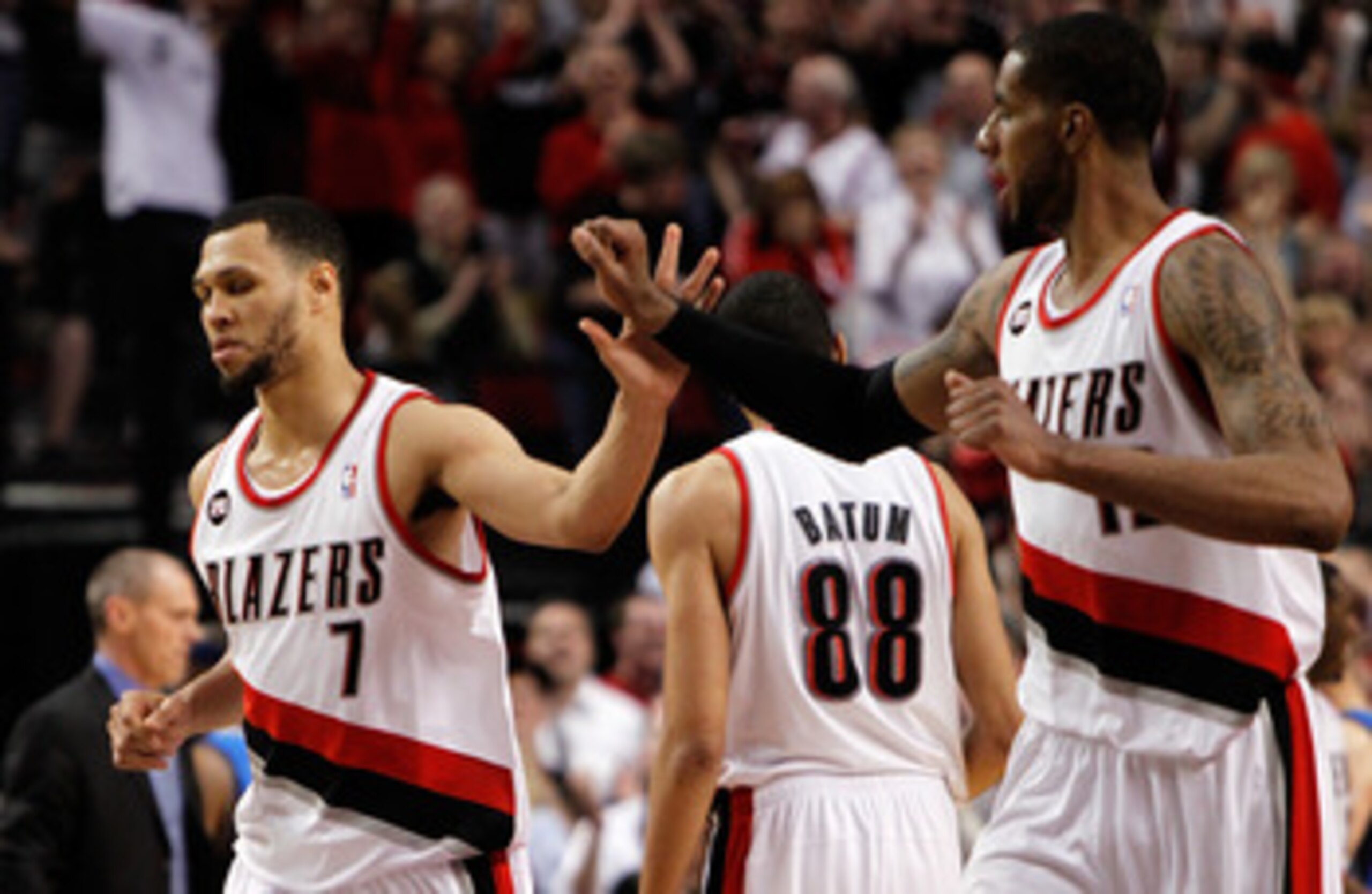 PORTLAND, OR - APRIL 23:  Brandon Roy #7 high fives LaMarcus Aldridge #12 of the Portland Trail Blazers against the Dallas Mavericks in Game Four of the Western Conference Quarterfinals in the 2011 NBA Playoffs on April 23, 2011 at the Rose Garden in Port