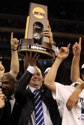 HOUSTON, TX - APRIL 04:  Head coach Jim Calhoun of the Connecticut Huskies celebrate with his team and the trophy after defeating the Butler Bulldogs to win the National Championship Game of the 2011 NCAA Division I Men's Basketball Tournament by a score