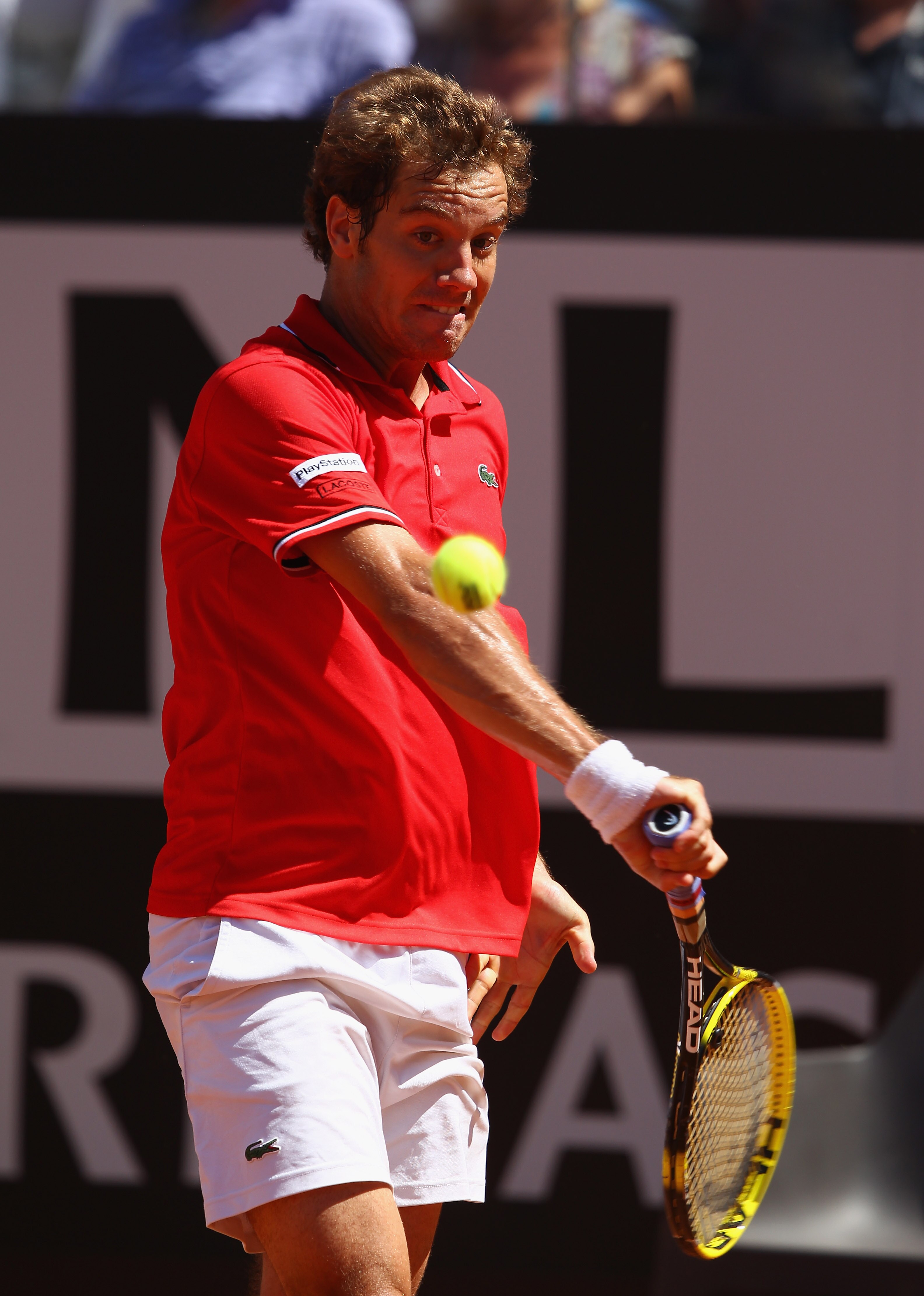 ROME, ITALY - MAY 14:  Richard Gasquet of France  plays a backhand during his semi final match against  Rafael Nadal of Spain during day seven of the Internazoinali BNL D'Italia at the Foro Italico Tennis Centre  on May 14, 2011 in Rome, Italy.  (Photo by