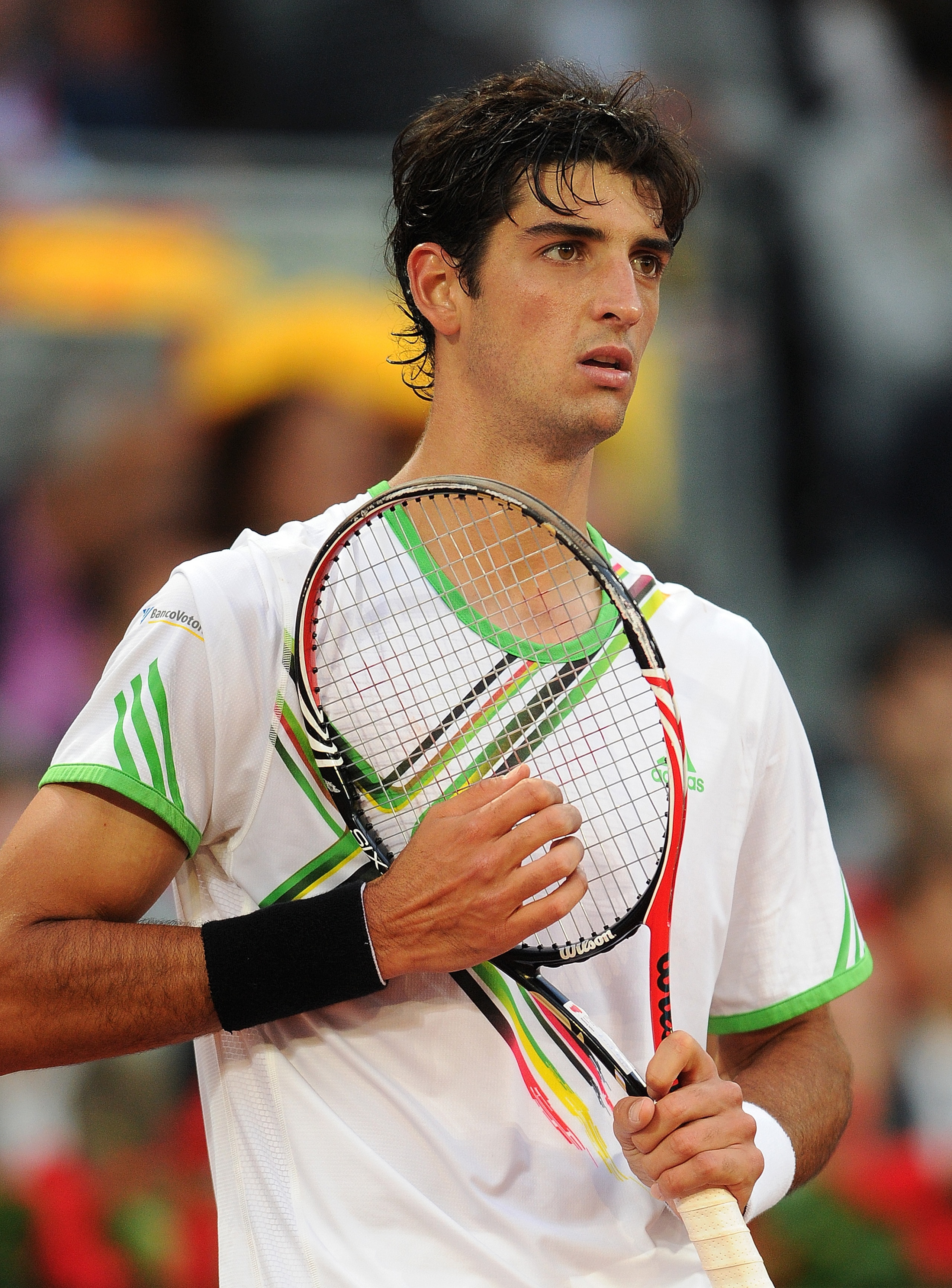 MADRID, SPAIN - MAY 07:  Thomaz Bellucci of Brazil waits for Novak Djokovic of Serbia to serve the ball in his semi final match during day seven of the Mutua Madrilena Madrid Open Tennis on May 7, 2011 in Madrid, Spain.  (Photo by Jasper Juinen/Getty Imag