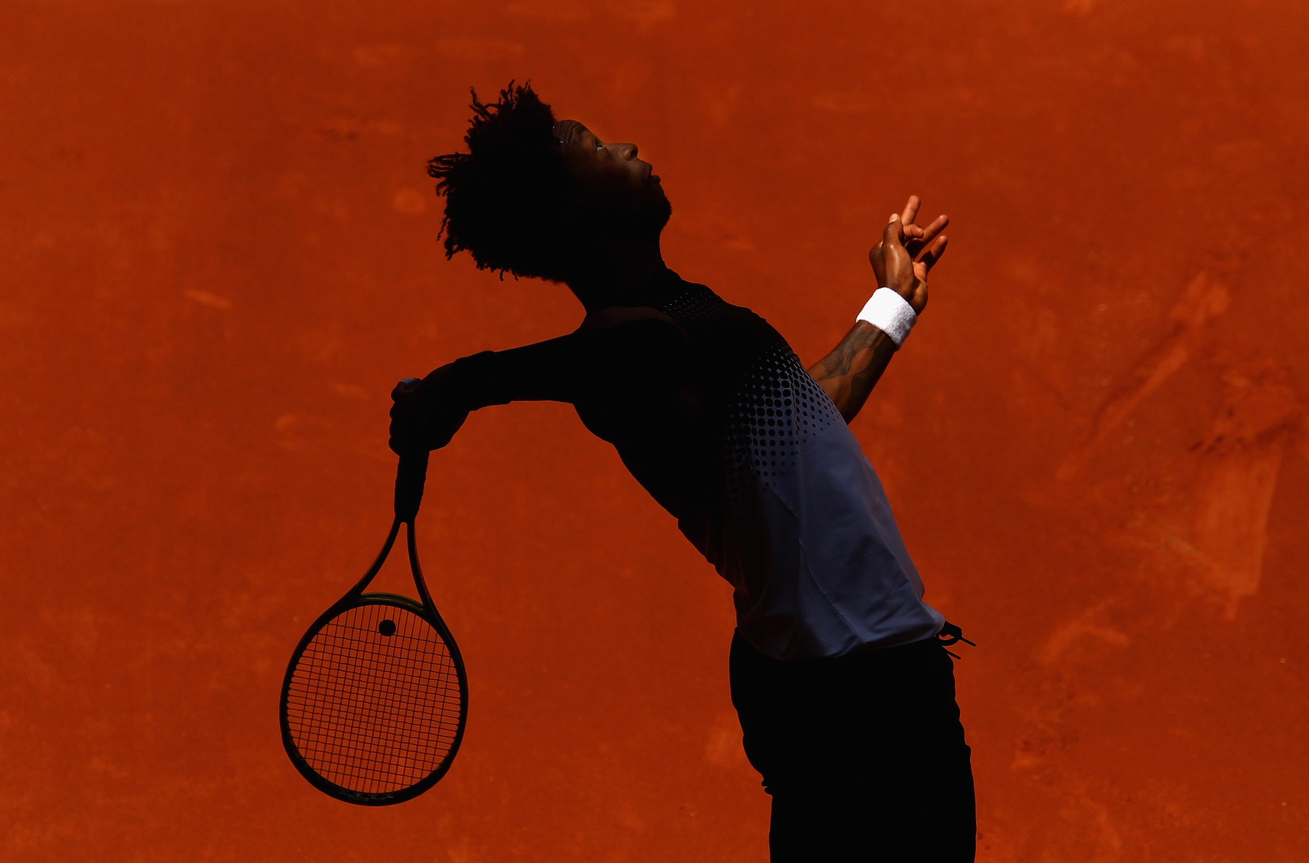 MADRID, SPAIN - MAY 02:  Gael Monfils of France serves to Ivo Karlovic of Croatia during day three of the Mutua Madrilena Madrid Open Tennis on May 2, 2011 in Madrid, Spain.  (Photo by Julian Finney/Getty Images)
