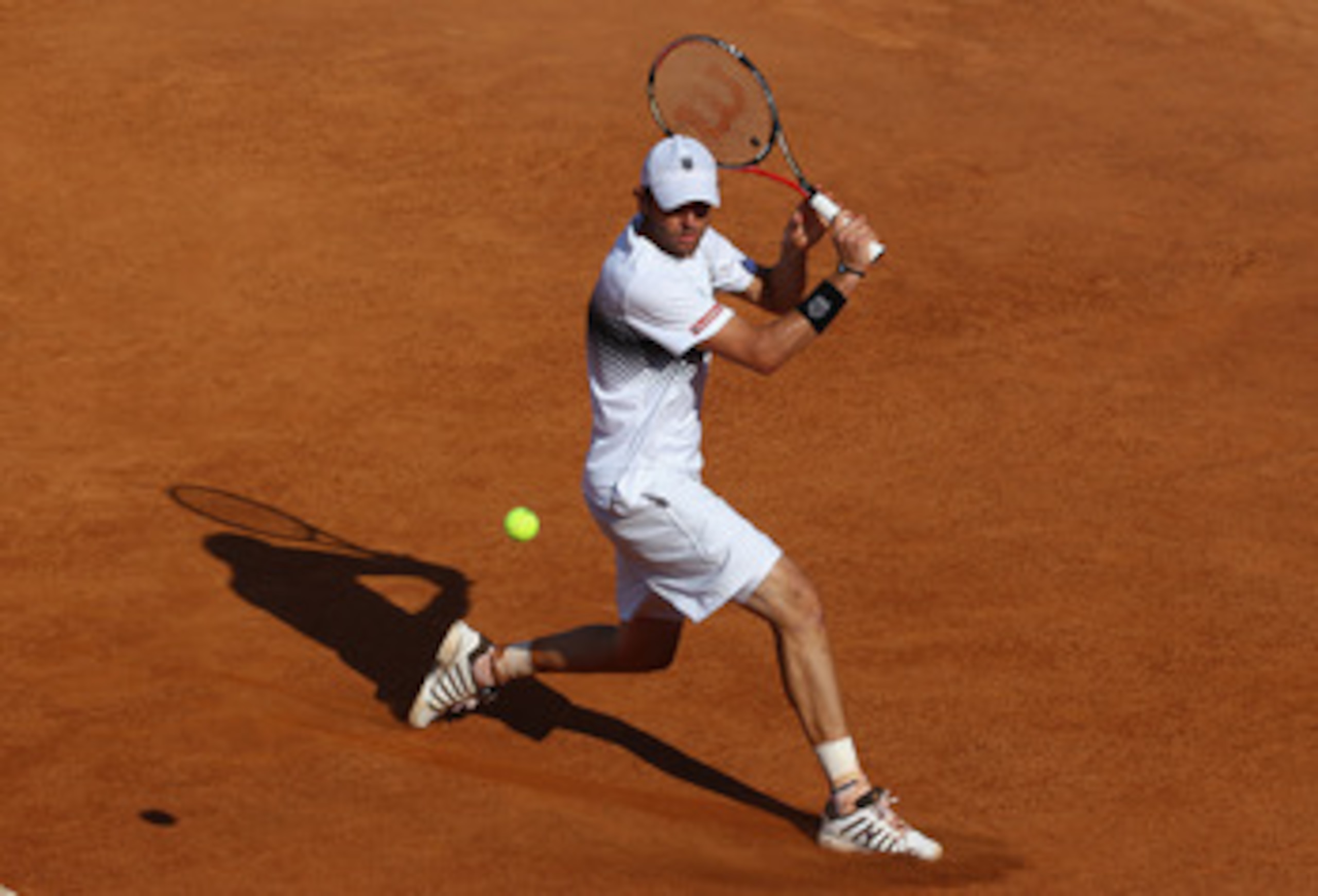ROME, ITALY - MAY 09:  Mardy Fish of the USA plays a backhand during his first round match against Santiago Giraldo of Columbia during day two of the Internazoinali BNL D'Italia at the Foro Italico Tennis Centre on May 9, 2011 in Rome, Italy.  (Photo by C