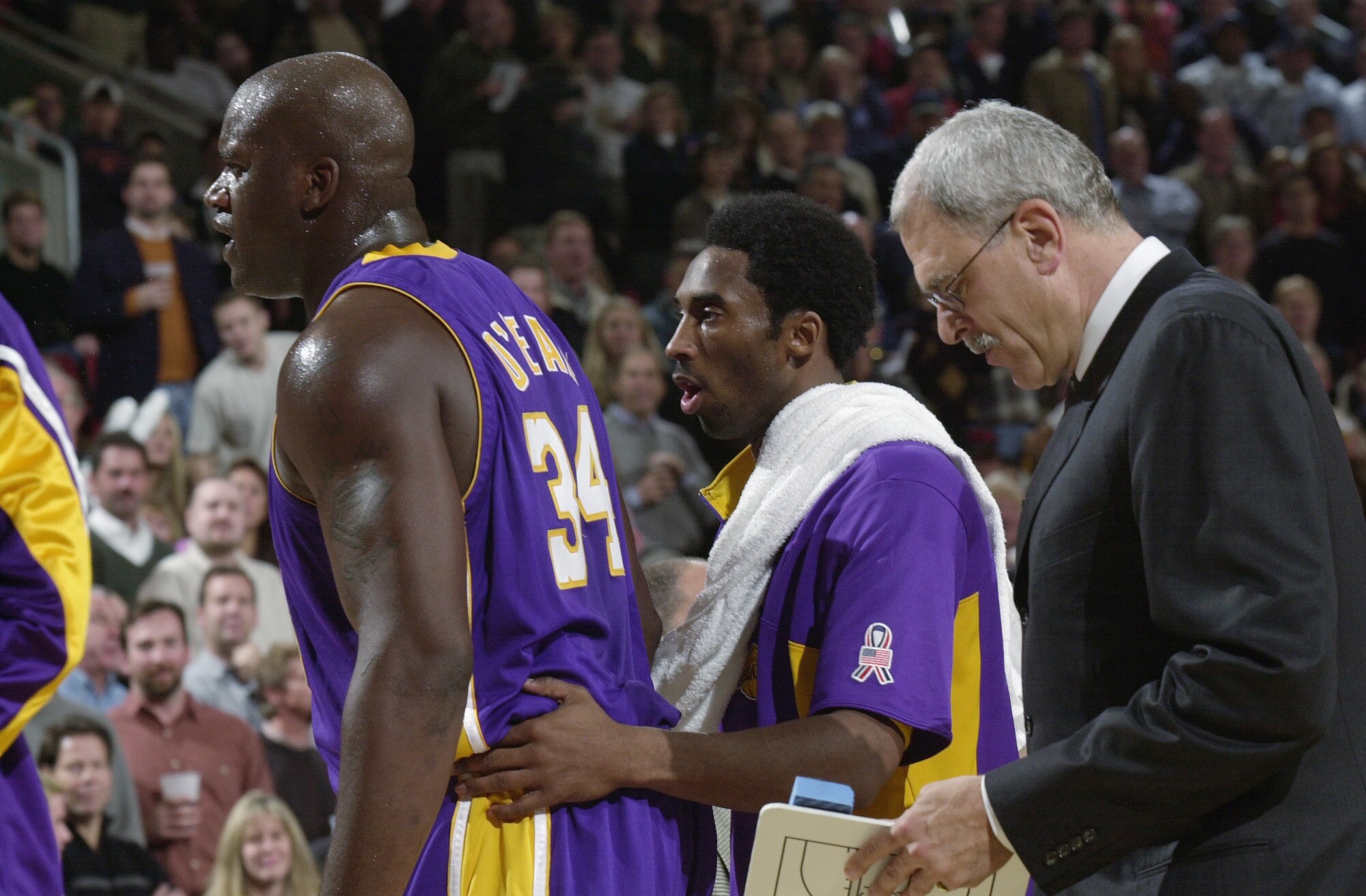 SEATTLE - NOVEMBER 30:  Center Shaquille O'Neal #34 of the Los Angeles Lakers stands on the sideline with guard Kobe Bryant #8 and head coach Phil Jackson during the NBA game against the Seattle SuperSonics at Key Arena in Seattle, Washington on November