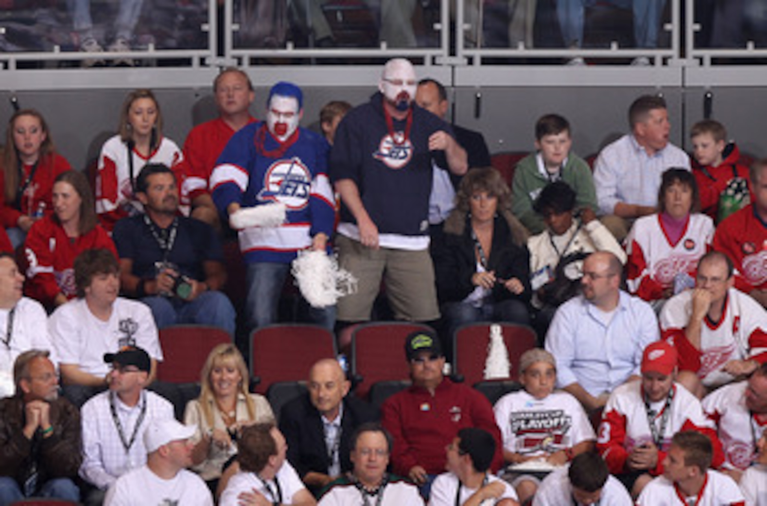 GLENDALE, AZ - APRIL 20:  Fans dressed in Winnipeg Jets uniforms attend Game Four of the Western Conference Quarterfinals between the Detroit Red Wings and the Phoenix Coyotes during the 2011 NHL Stanley Cup Playoffs at Jobing.com Arena on April 20, 2011 