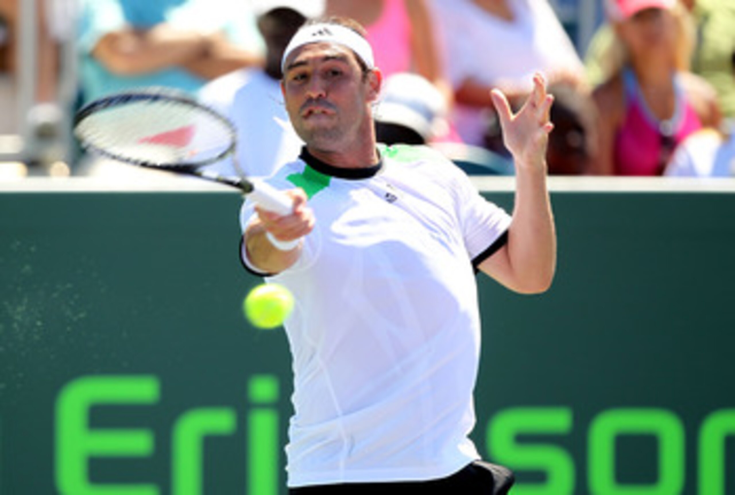 KEY BISCAYNE, FL - MARCH 26:  Marcos Baghdatis of Cyprus returns against Oliver Rochus of Belgium during the Sony Ericsson Open at Crandon Park Tennis Center on March 26, 2011 in Key Biscayne, Florida.  (Photo by Al Bello/Getty Images)