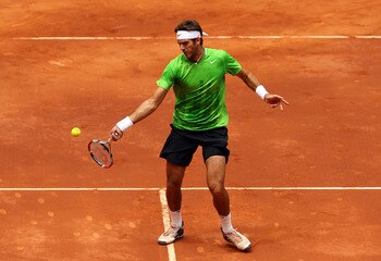 MADRID, SPAIN - MAY 03:  Juan Martin Del Potro of Argentina plays a forehand in his match against Mikhail Youzhny of Russia during day four of the Mutua Madrilena Madrid Open Tennis on May 3, 2011 in Madrid, Spain.  (Photo by Julian Finney/Getty Images)