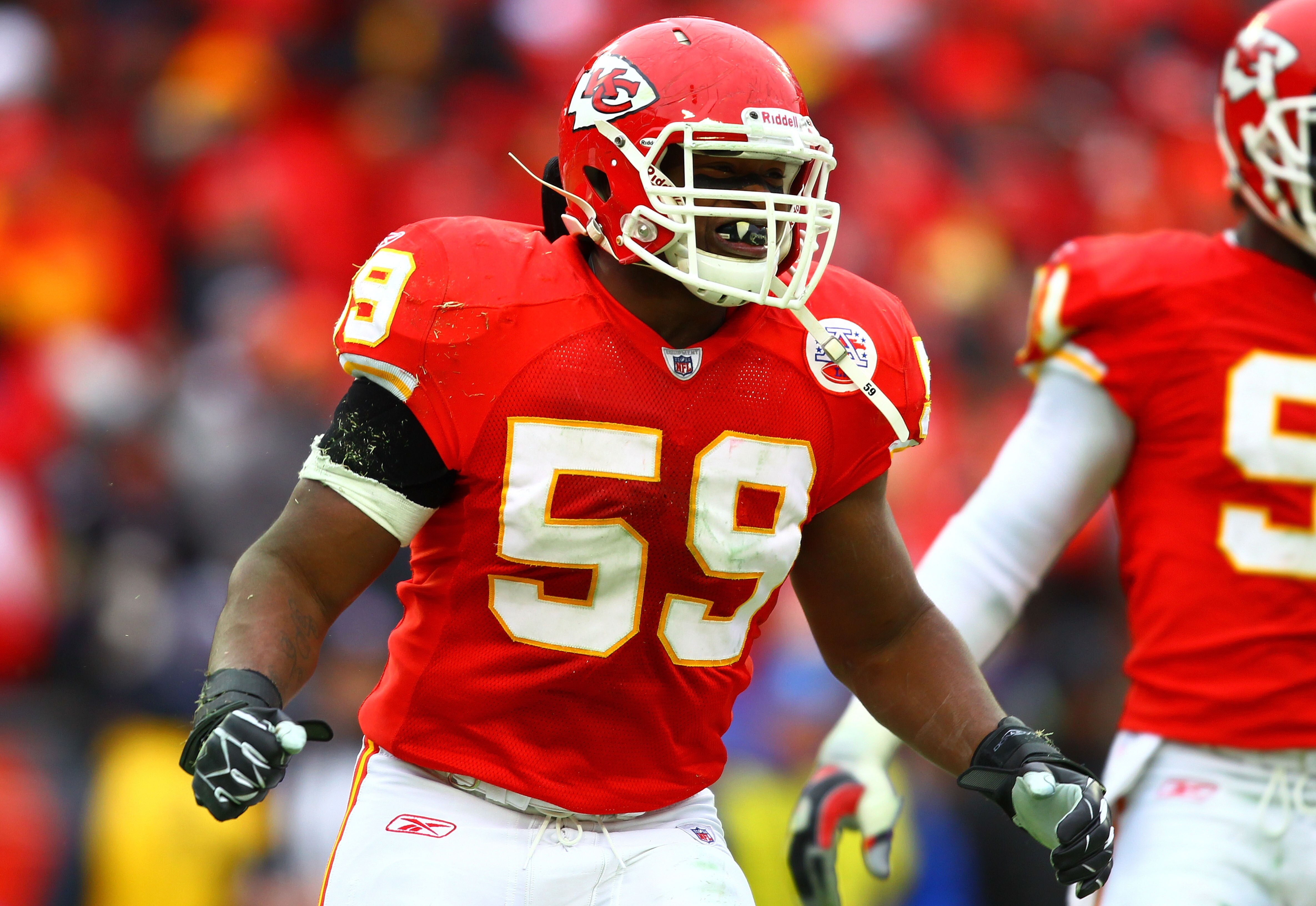 KANSAS CITY, MO - JANUARY 09:  Linebacker Jovan Belcher #59 of the Kansas City Chiefs celebrates a sack of quarterback Joe Flacco #5 of the Baltimore Ravens during their 2011 AFC wild card playoff game at Arrowhead Stadium on January 9, 2011 in Kansas Cit