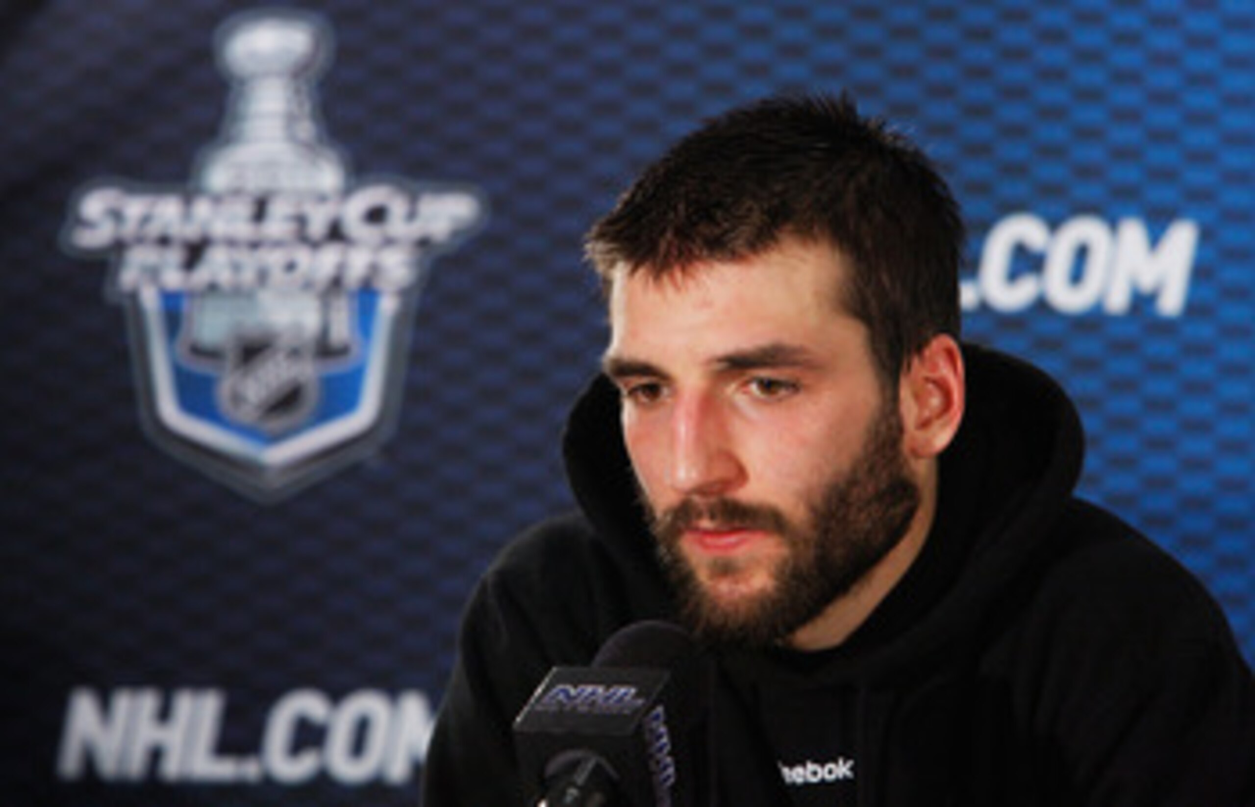 TAMPA, FL - MAY 19:  Patrice Bergeron #37 of the Boston Bruins speaks to the media after they defeated the Tampa Bay Lightning 2 to 0 in Game Three of the Eastern Conference Finals during the 2011 NHL Stanley Cup Playoffs at St Pete Times Forum on May 19,