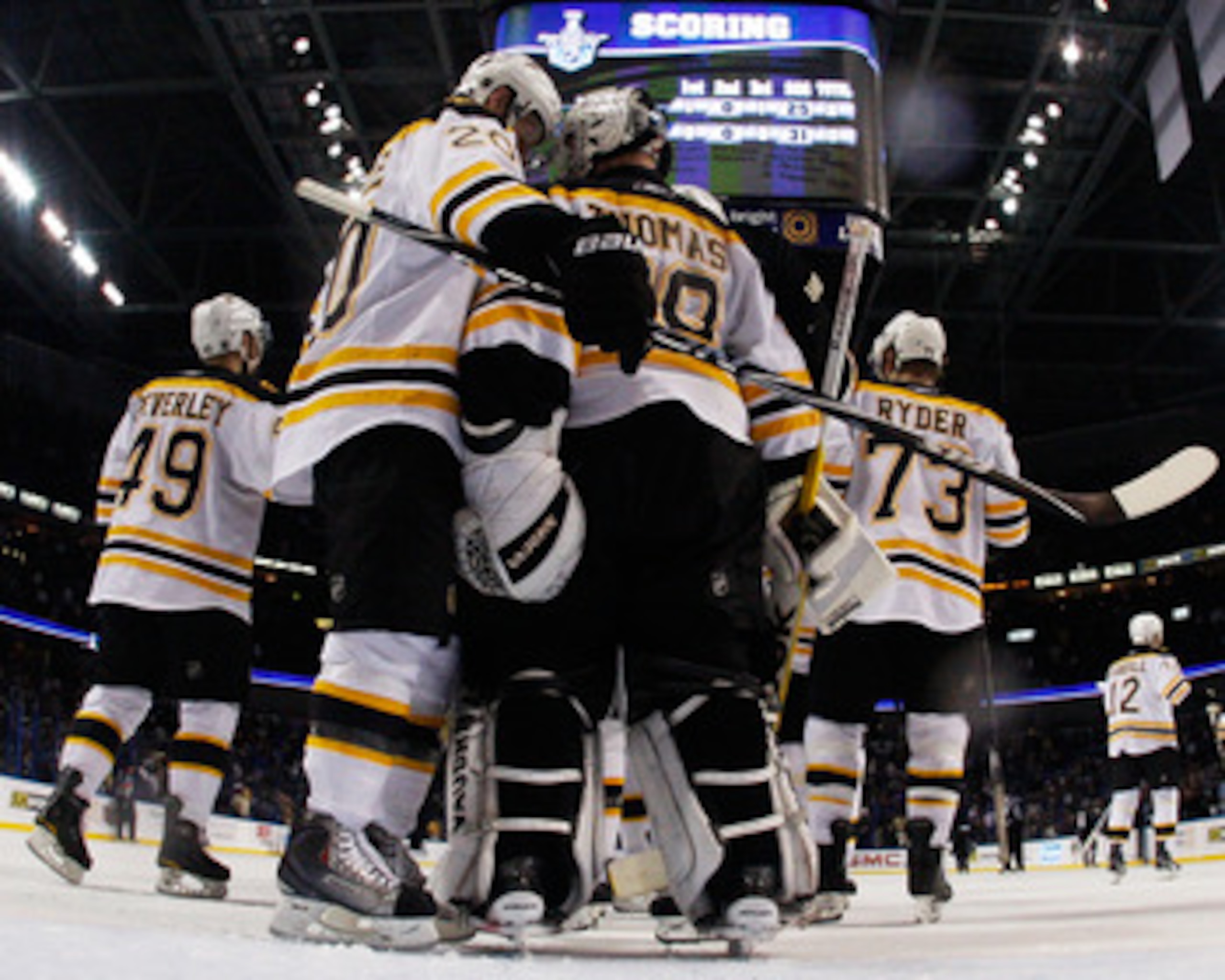 TAMPA, FL - MAY 19:  Tim Thomas #30 and Daniel Paille #20 of the Boston Bruins celebrate with their teammates after they defeated the Tampa Bay Lightning 2 to 0 in Game Three of the Eastern Conference Finals during the 2011 NHL Stanley Cup Playoffs at St 