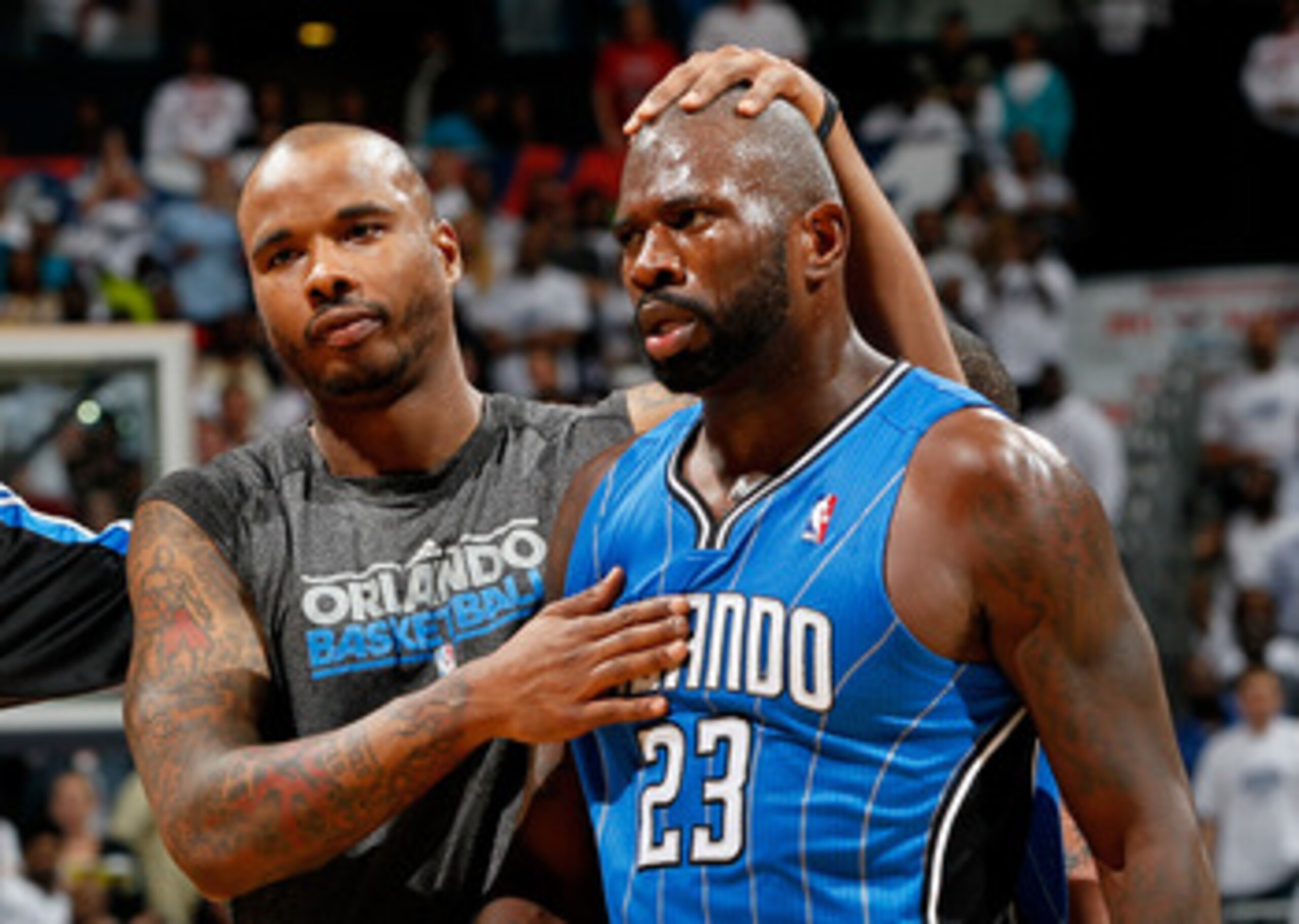 ATLANTA, GA - APRIL 22: Jason Richardson #23 of the Orlando Magic walks off the court with Quentin Richardson #5 after being ejected for fighting with Zaza Pachulia #27 of the Atlanta Hawks during Game Three of the Eastern Conference Quarterfinals in the ATLANTA, GA - APRIL 22: Jason Richardson #23 of the Orlando Magic walks off the court with Quentin Richardson #5 after being ejected for fighting with Zaza Pachulia #27 of the Atlanta Hawks during Game Three of the Eastern Conference Quarterfinals in the