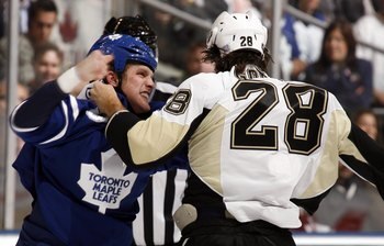 TORONTO - OCTOBER 10:  Colton Orr #28 of the Toronto Maple Leafs fights Eric Godard #28 of the Pittsburgh Penguins during a NHL game at the Air Canada Centre on October 10, 2009 in Toronto, Ontario, Canada .  (Photo by Abelimages/Getty Images)