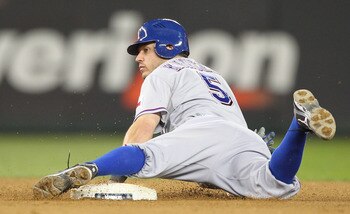 SEATTLE - MAY 04:  Ian Kinsler #5 of the Texas Rangers slides into second base against the Seattle Mariners at Safeco Field on May 4, 2011 in Seattle, Washington. (Photo by Otto Greule Jr/Getty Images)