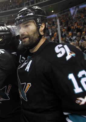 SAN JOSE, CA - MAY 12:  Joe Pavelski #8 and Patrick Marleau #12 congratulate Antti Niemi #31 of the San Jose Sharks after thye beat the Detroit Red Wings in Game Seven of the Western Conference Semifinals during the 2011 NHL Stanley Cup Playoffs at HP Pav